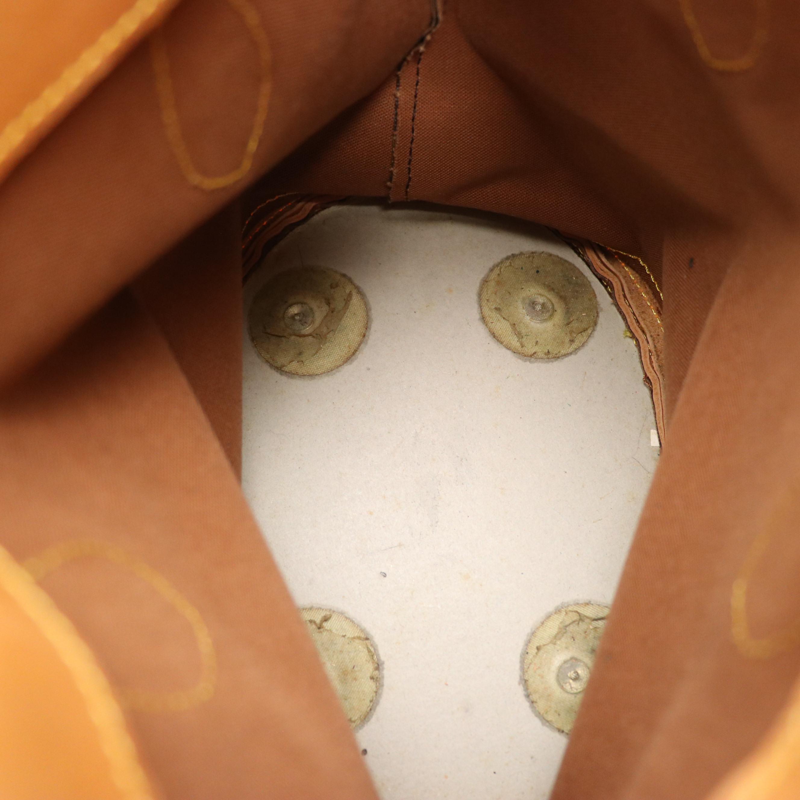 Louis Vuitton Petite Bucket Bag in Monogram Canvas and Vachetta Leather