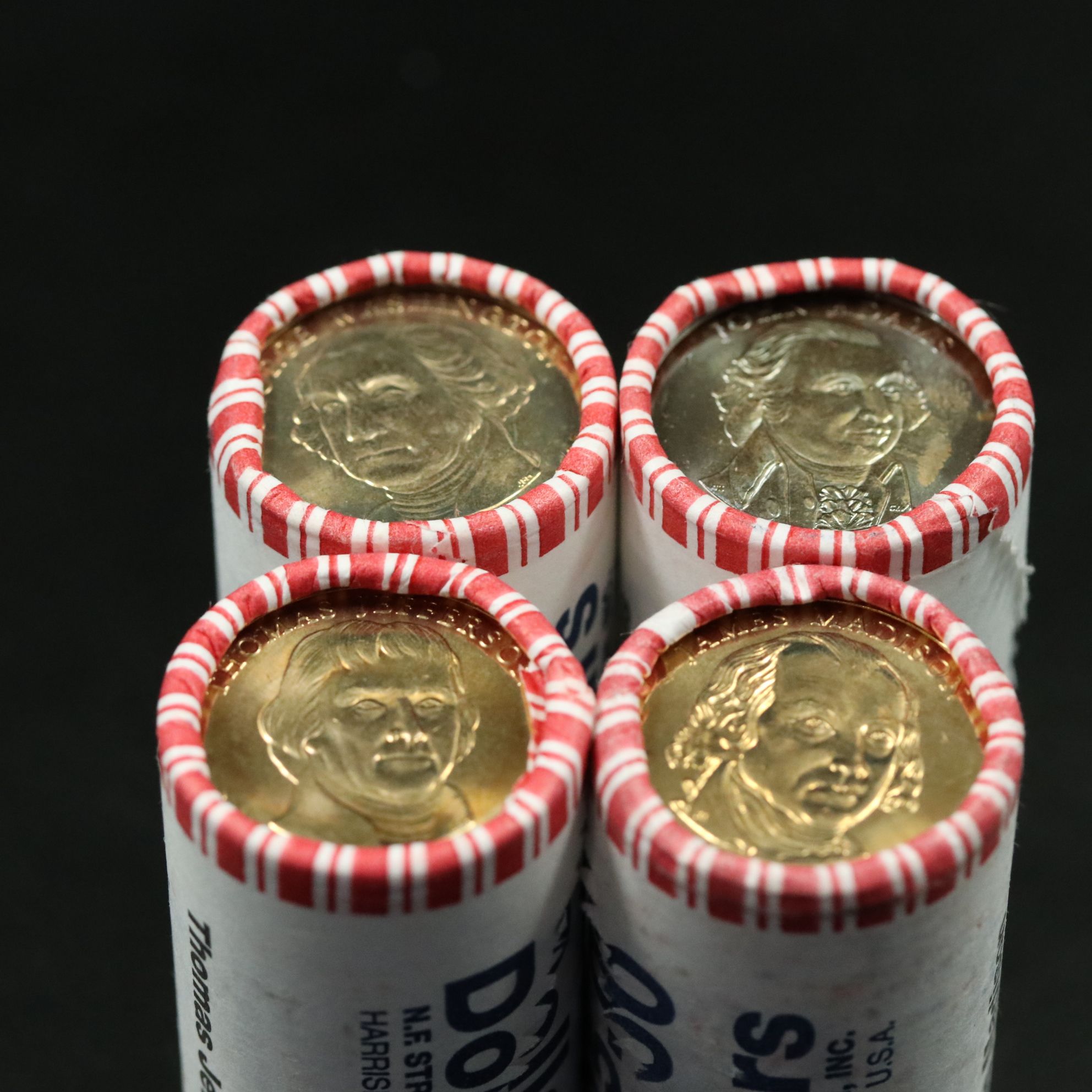 Four Different Mint Rolls of 25 Presidential Dollars