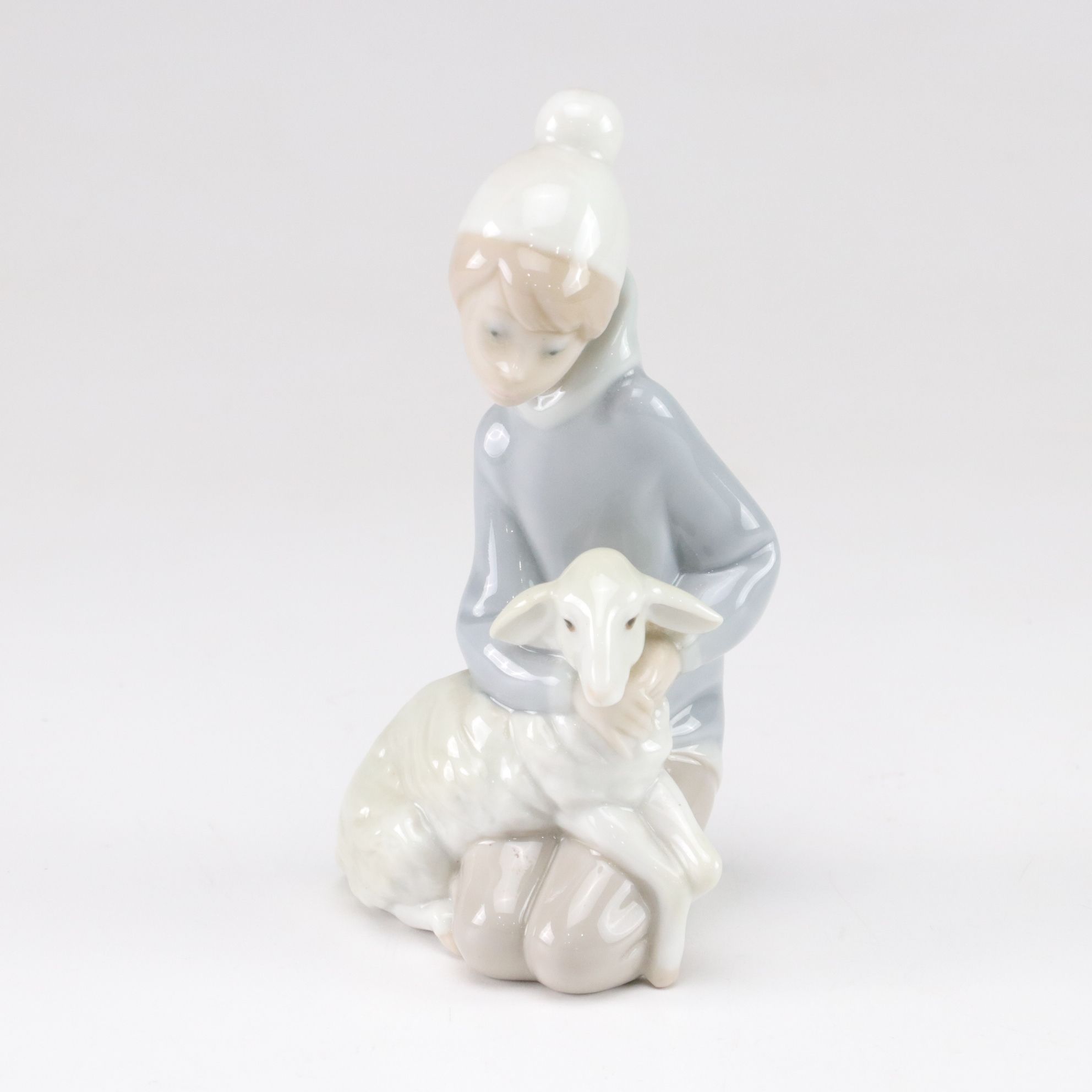 Lladró "Little Couple Kissing" and "Boy with Lamb" with Tengra Figure, 1990s