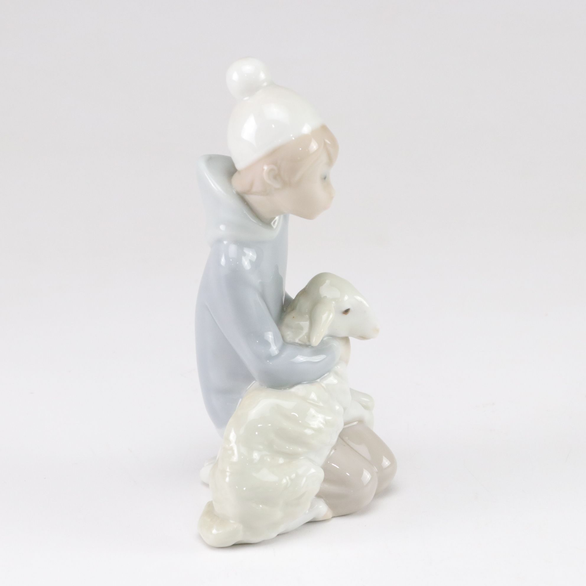 Lladró "Little Couple Kissing" and "Boy with Lamb" with Tengra Figure, 1990s