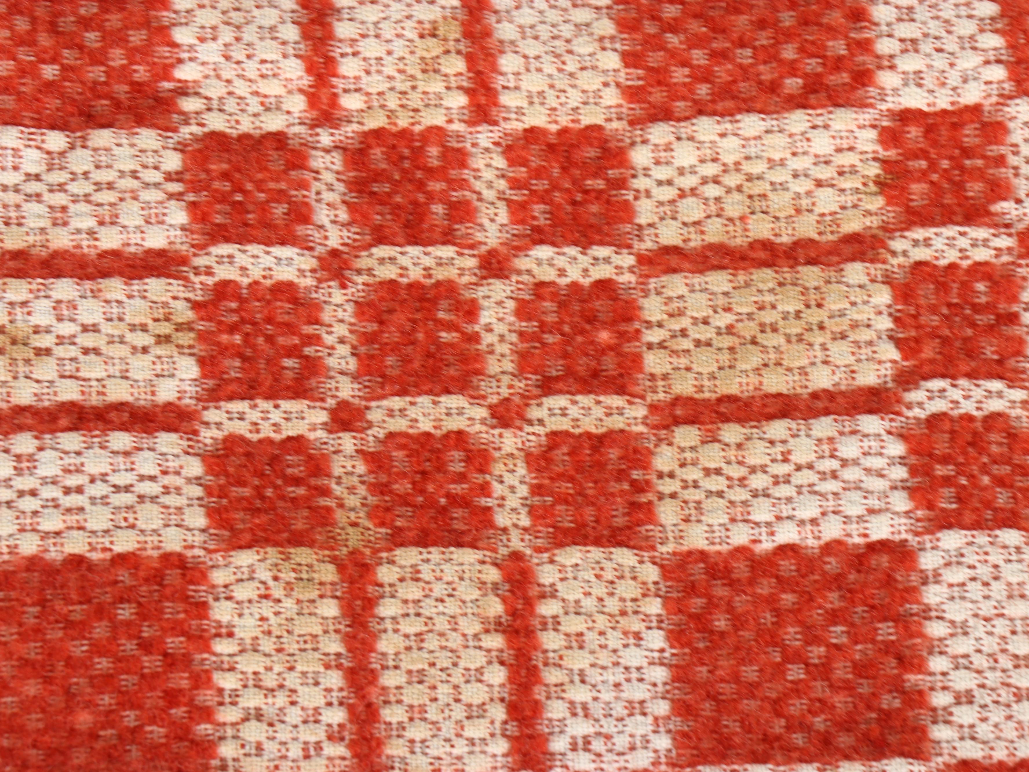 American Colonial Style Oak Quilt Rack with Red and White Woven Coverlet, 20th C