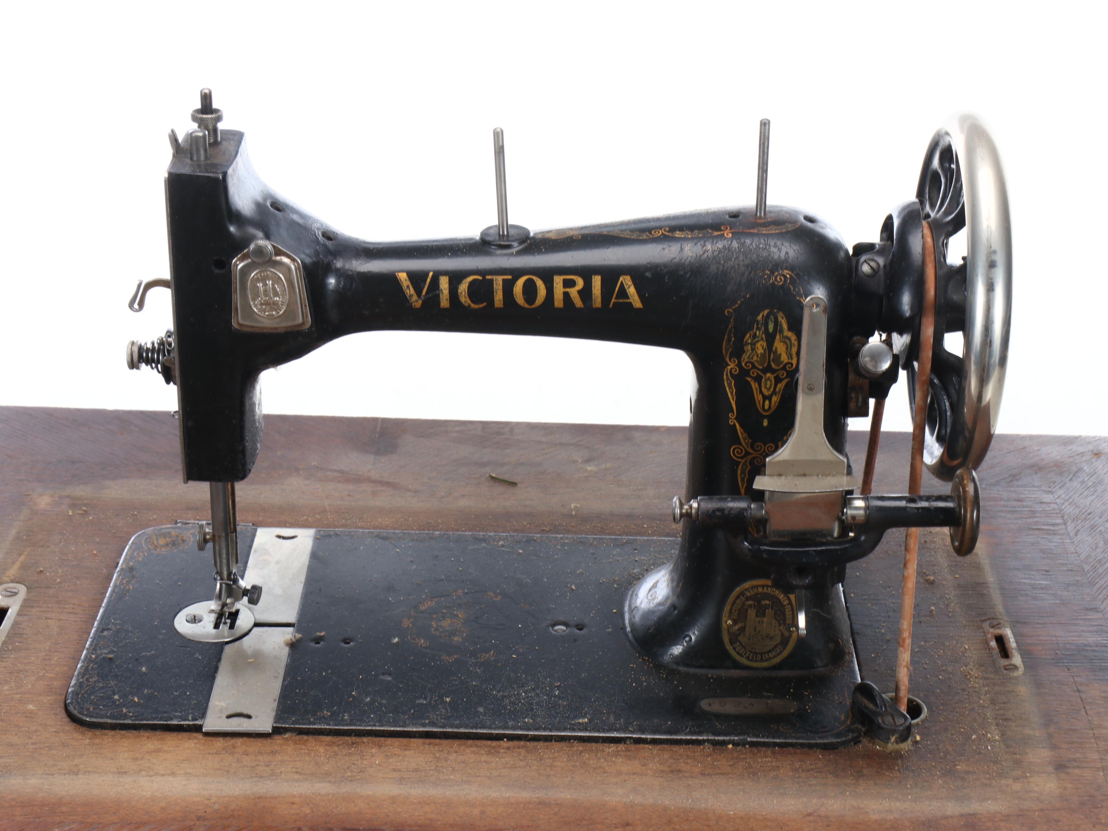 Victoria Sewing Machine with Mahogany Veneer Dome Treadle Table, circa 1906