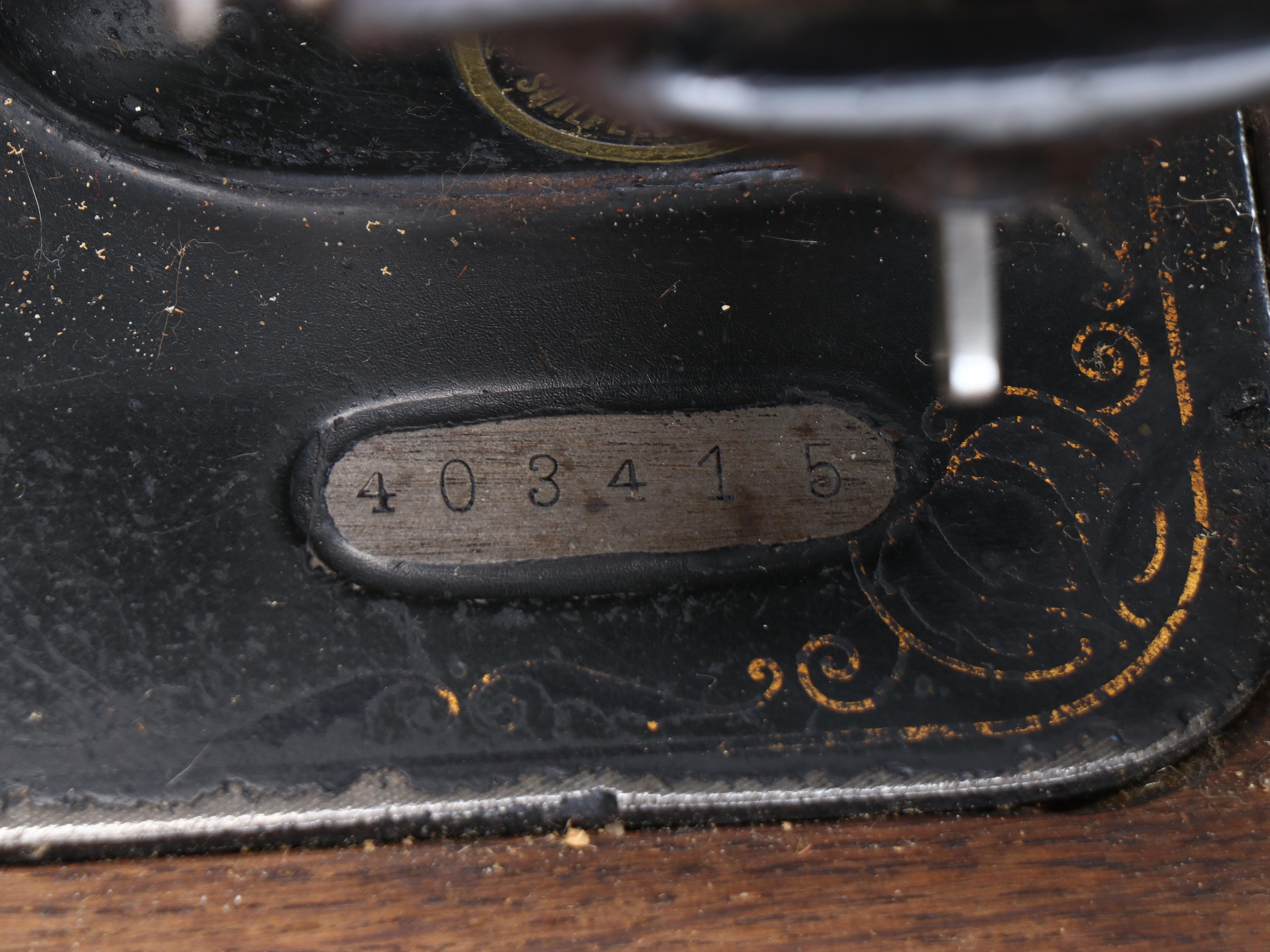 Victoria Sewing Machine with Mahogany Veneer Dome Treadle Table, circa 1906