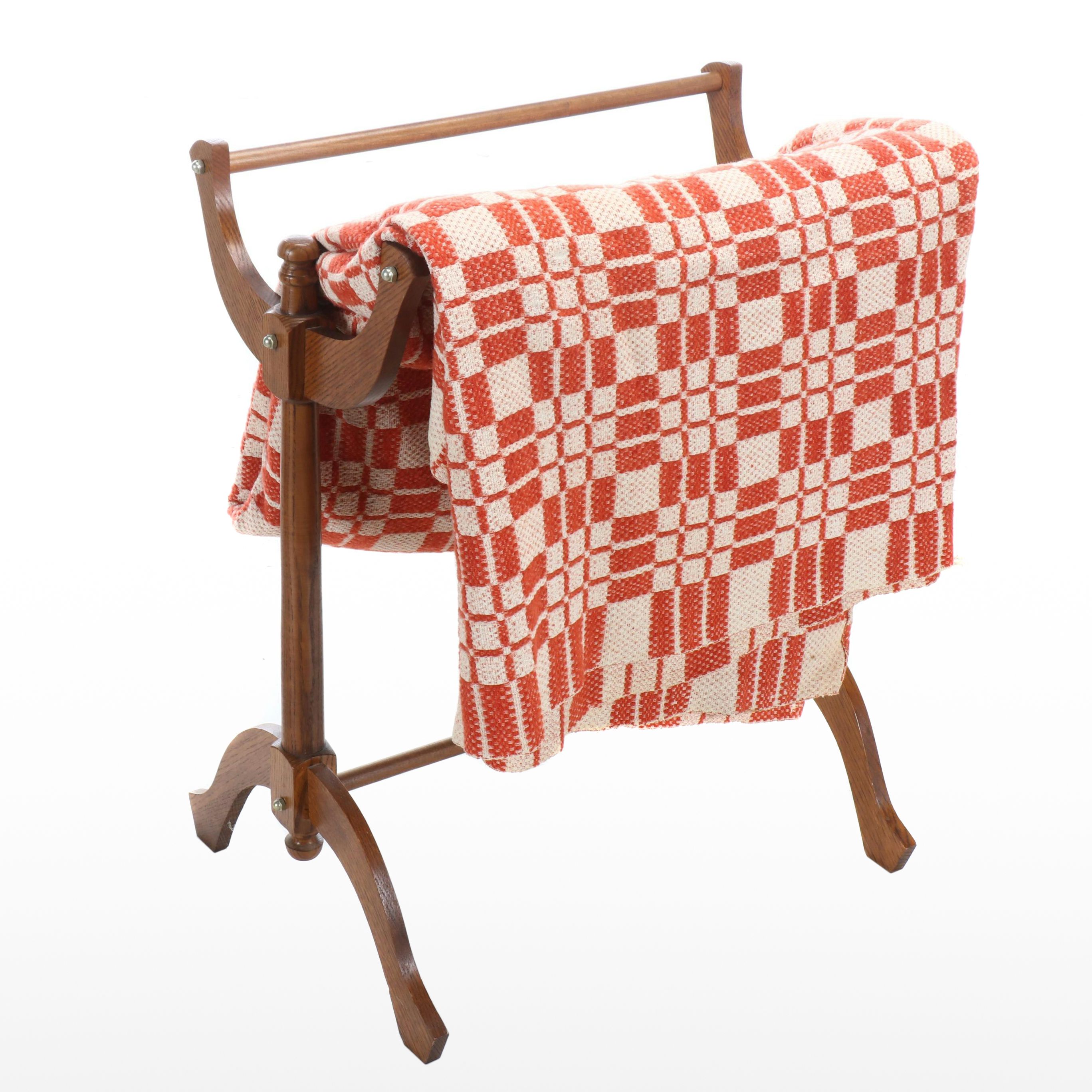 American Colonial Style Oak Quilt Rack with Red and White Woven Coverlet, 20th C