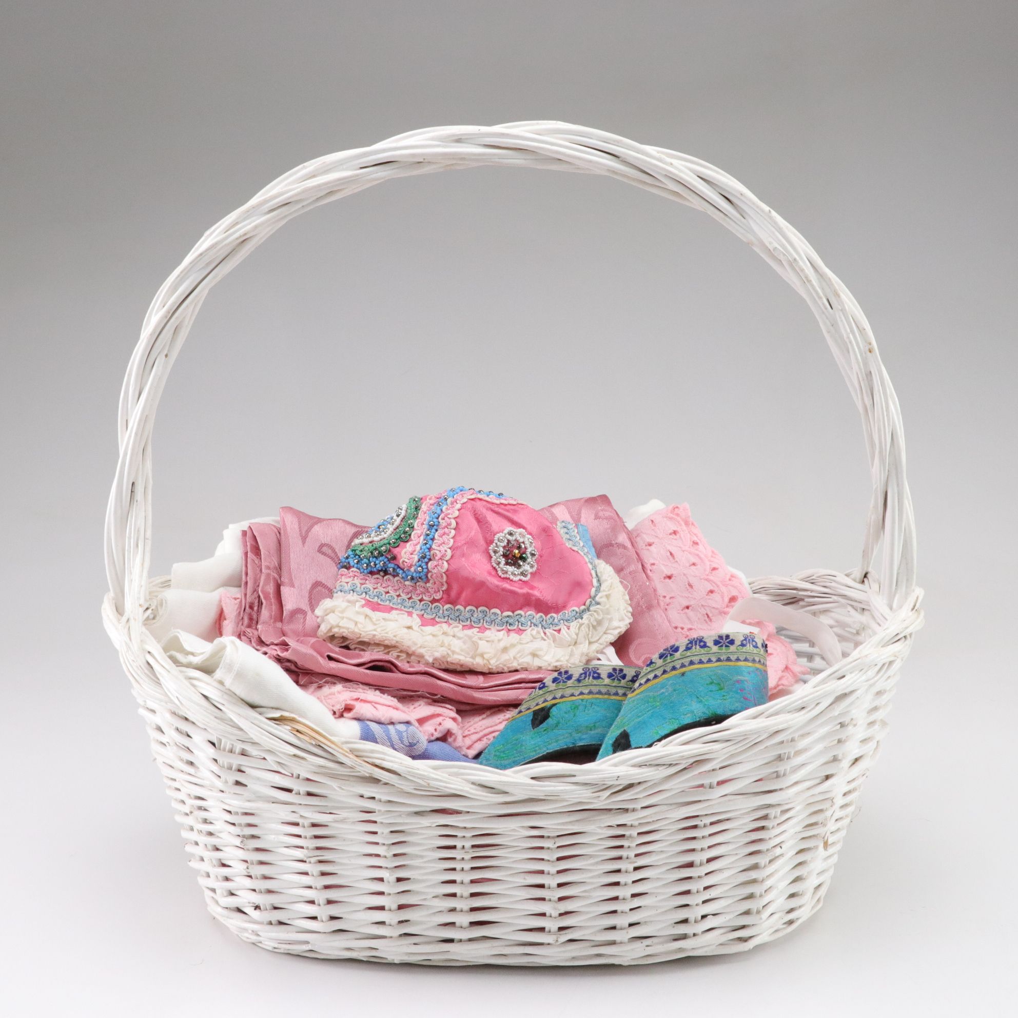 Basket Containing Silk Chinese Shoes, Baby Bonnet, Linens and More