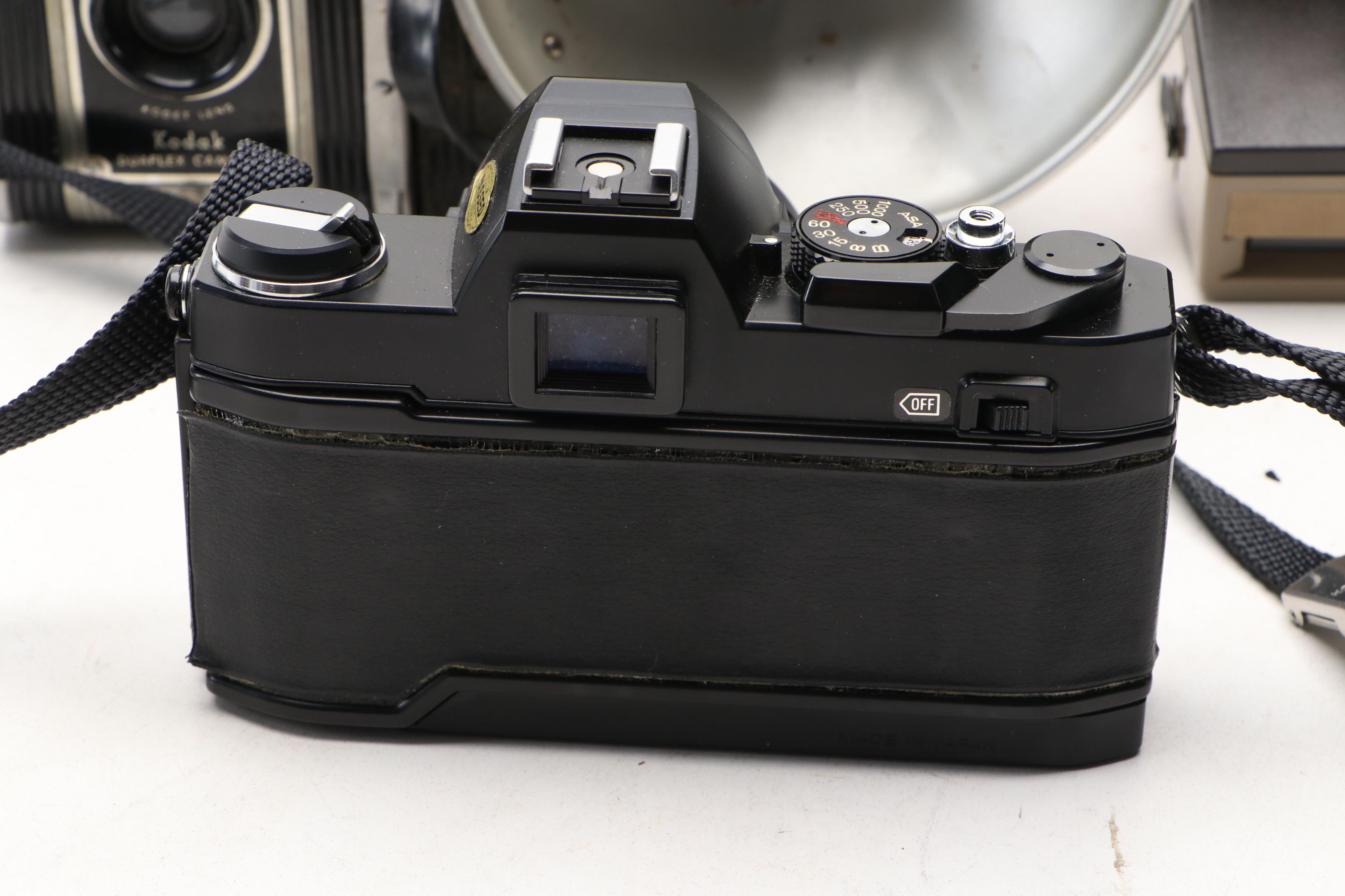 Konica Autoreflex TC SLR with Polaroid Super Clincher and Kodak TLR, 20th C.