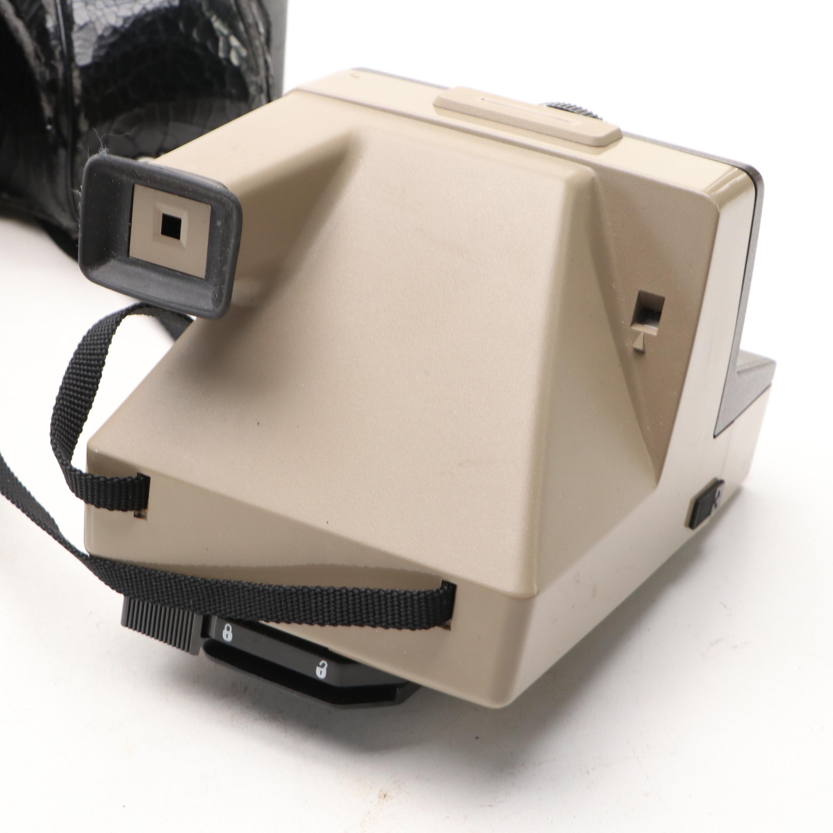 Konica Autoreflex TC SLR with Polaroid Super Clincher and Kodak TLR, 20th C.