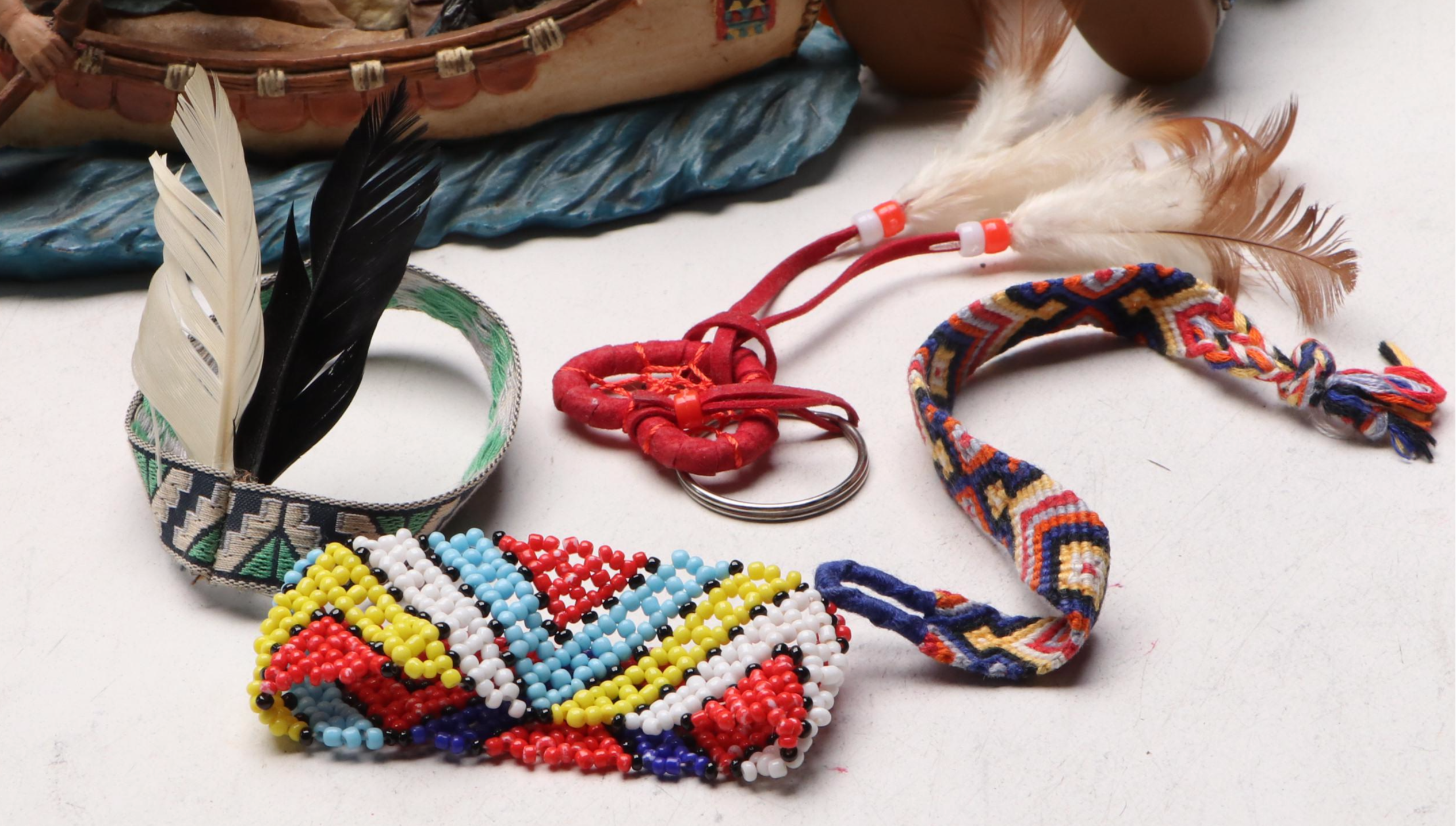 Native American Figurine and Doll Collection Featuring Painting Book