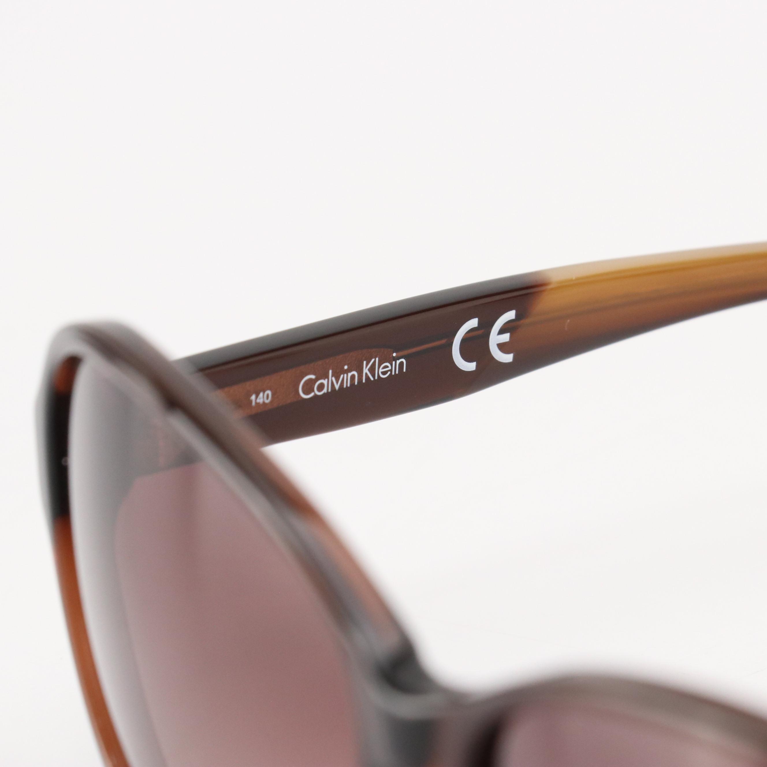 Calvin Klein CK4334SA 210 Brown Oval Sunglasses in Case