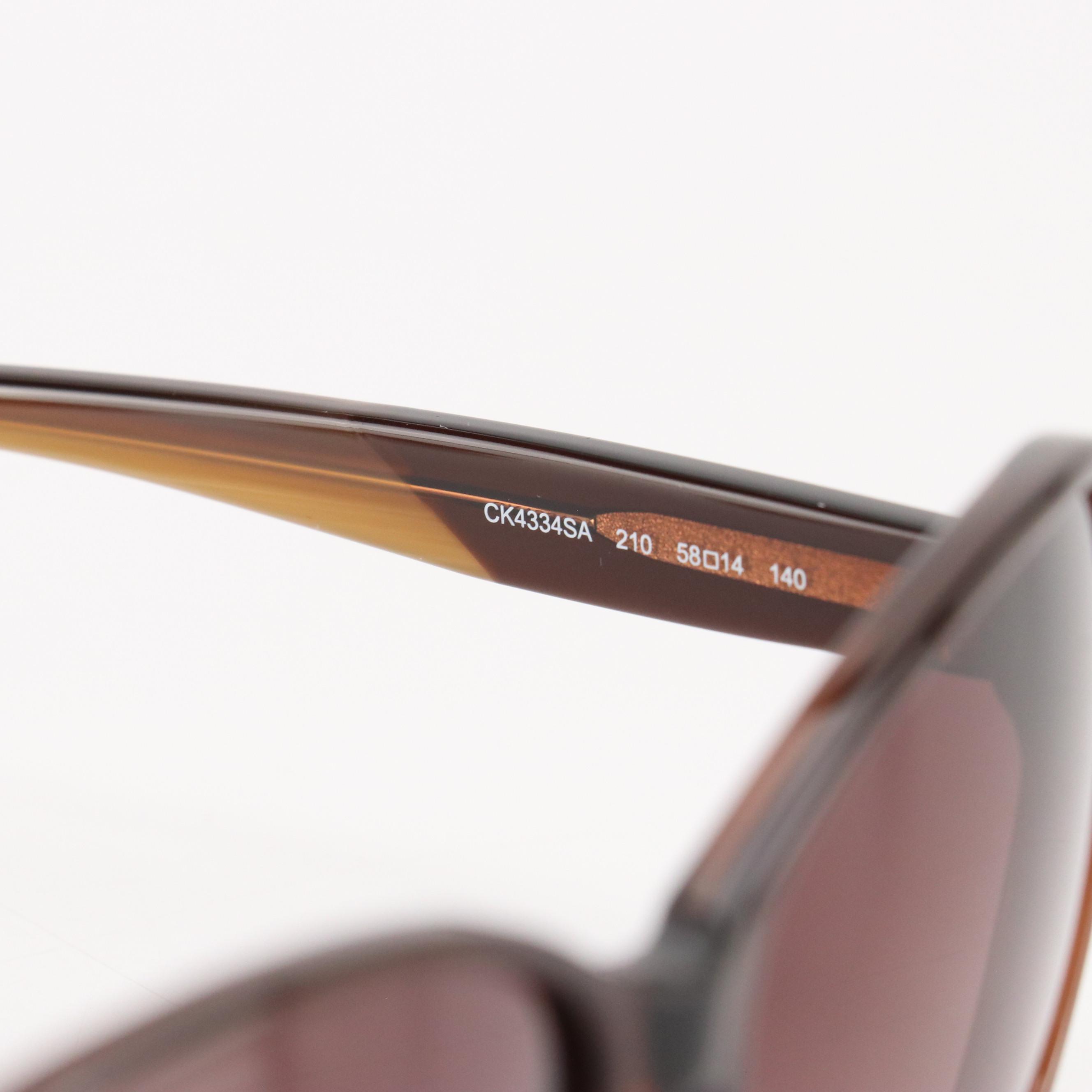 Calvin Klein CK4334SA 210 Brown Oval Sunglasses in Case