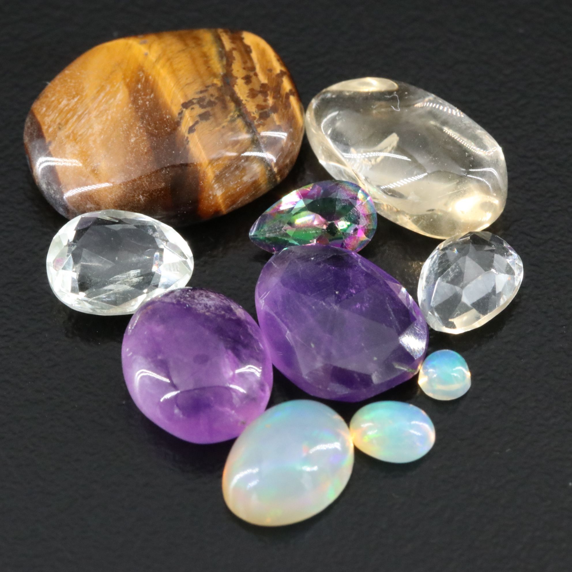 Loose Gemstone Collection Featuring Amethyst, Tiger's Eye and Prasiolite