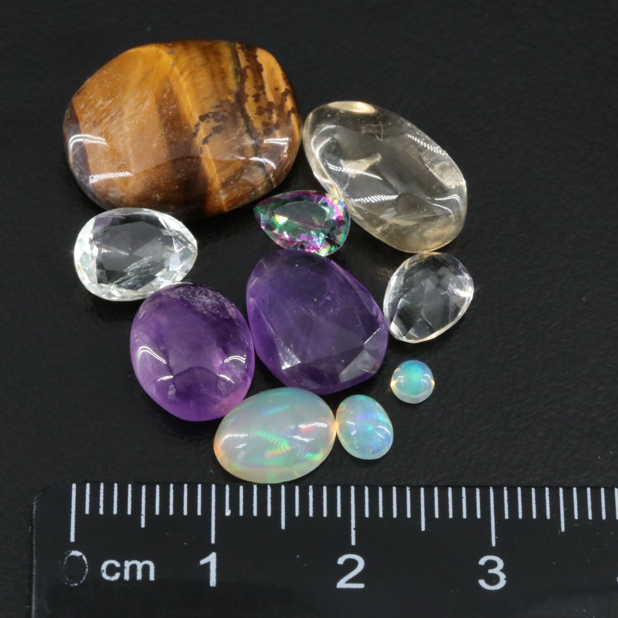 Loose Gemstone Collection Featuring Amethyst, Tiger's Eye and Prasiolite