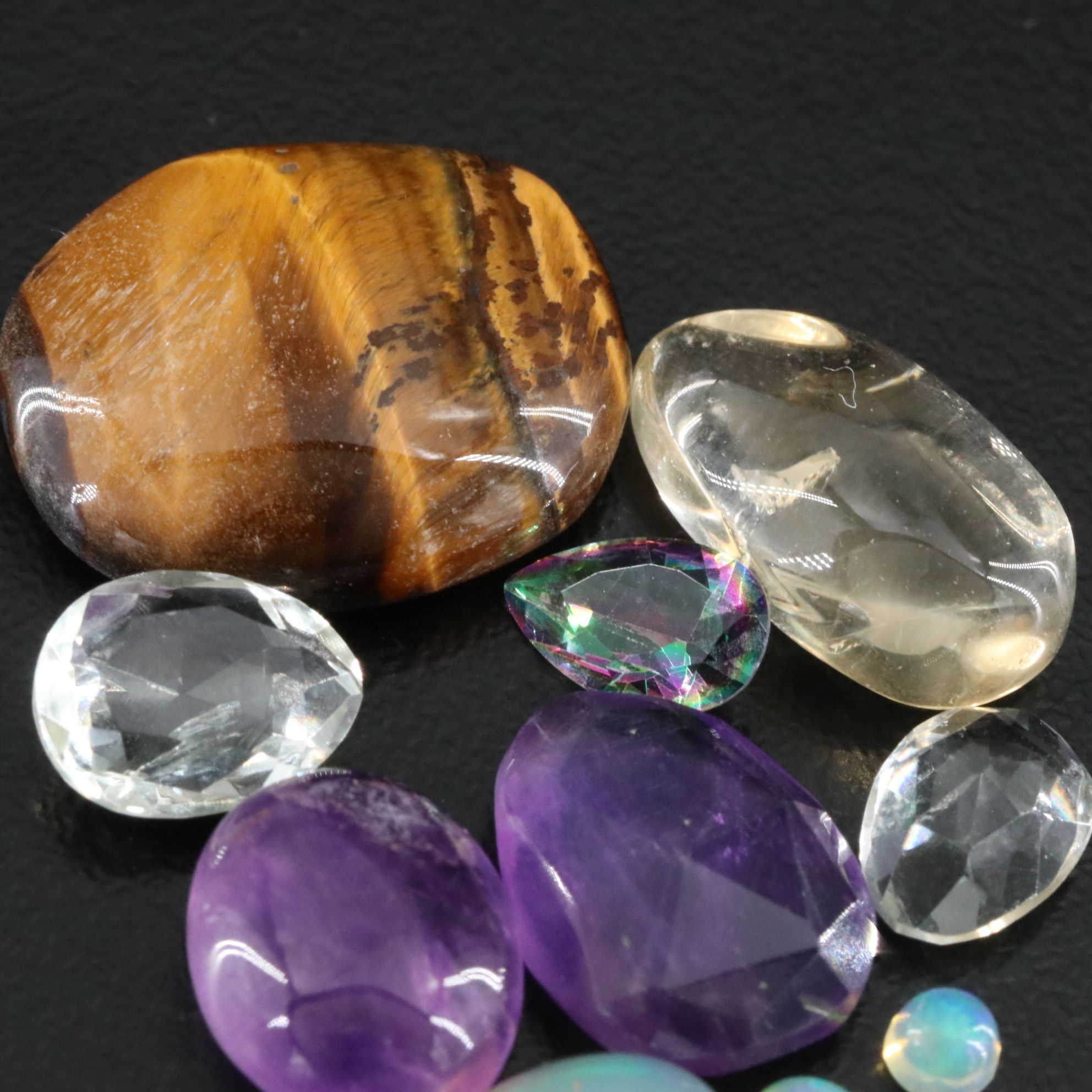 Loose Gemstone Collection Featuring Amethyst, Tiger's Eye and Prasiolite