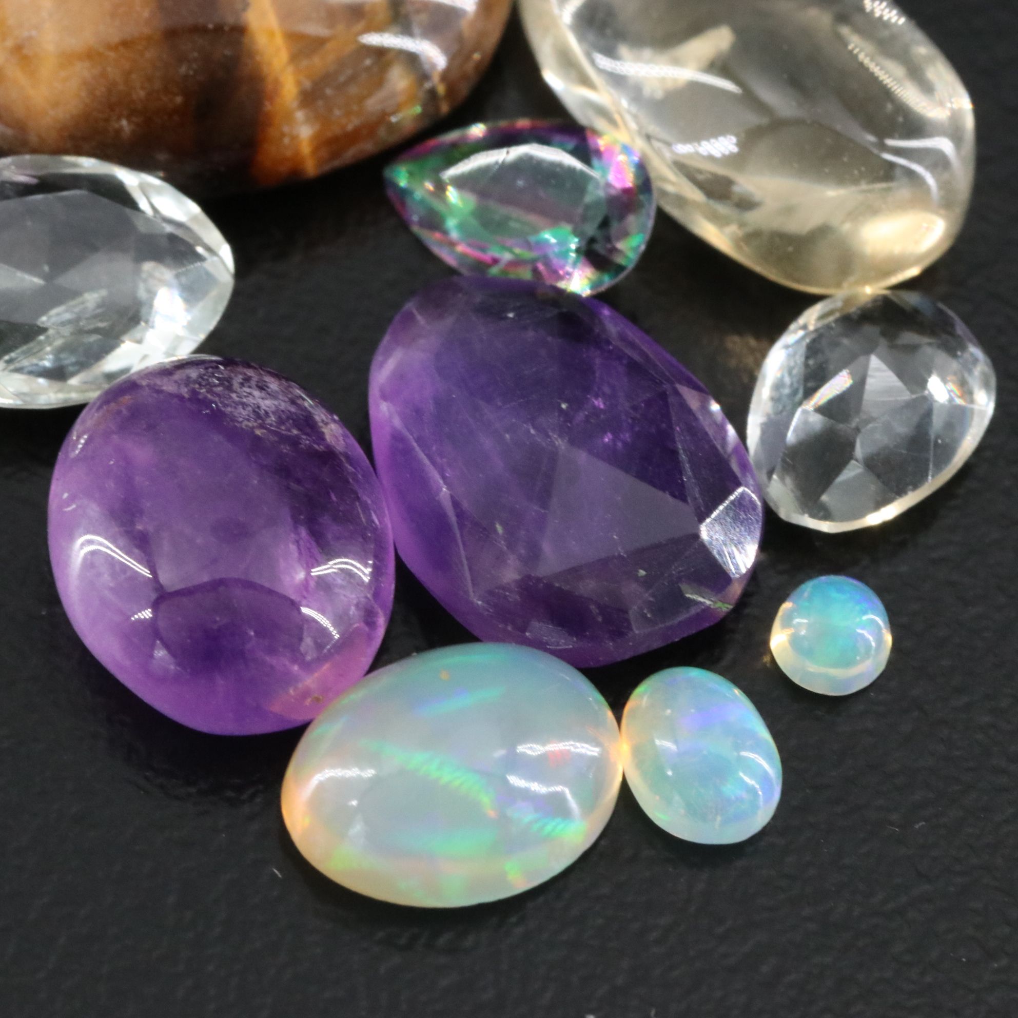 Loose Gemstone Collection Featuring Amethyst, Tiger's Eye and Prasiolite