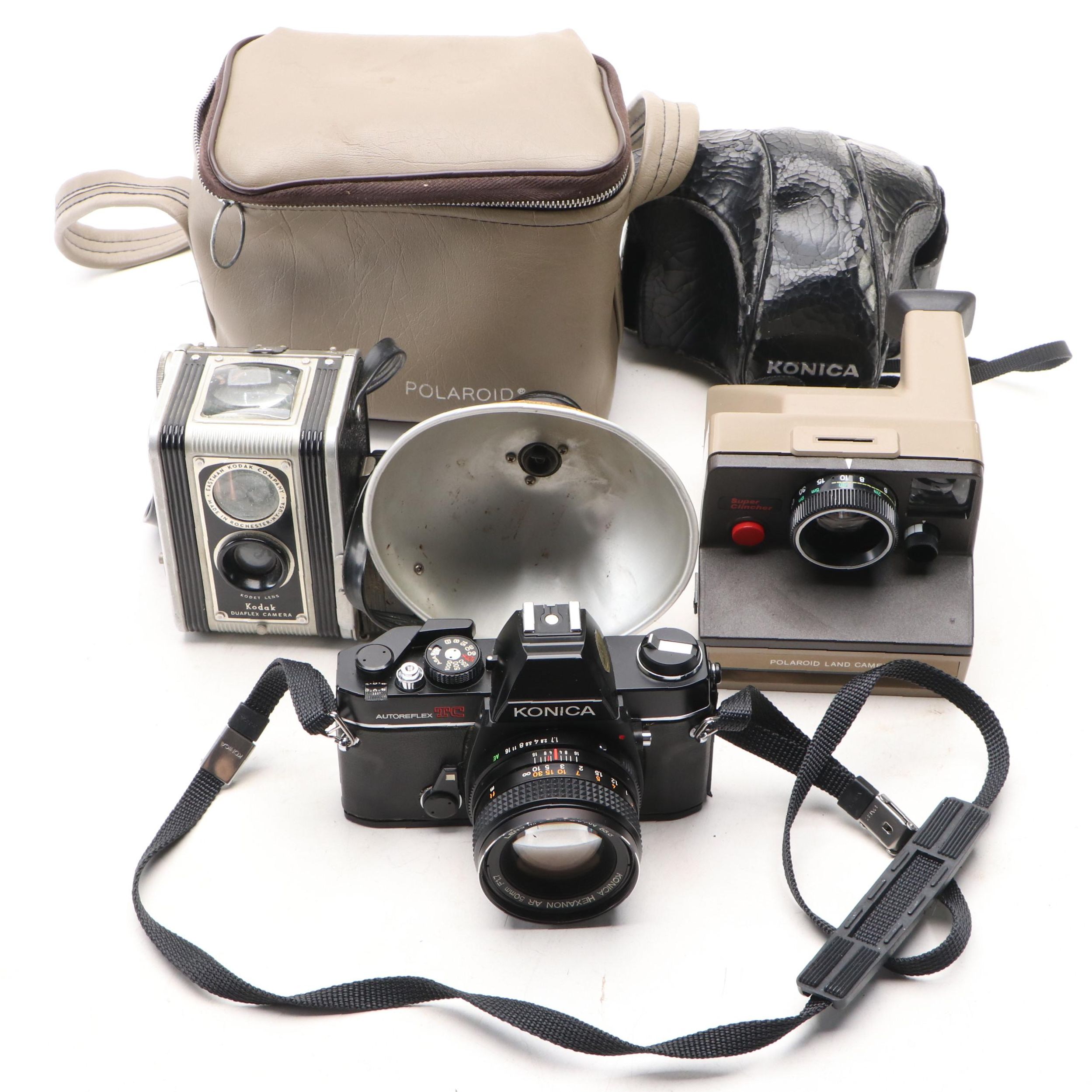 Konica Autoreflex TC SLR with Polaroid Super Clincher and Kodak TLR, 20th C.
