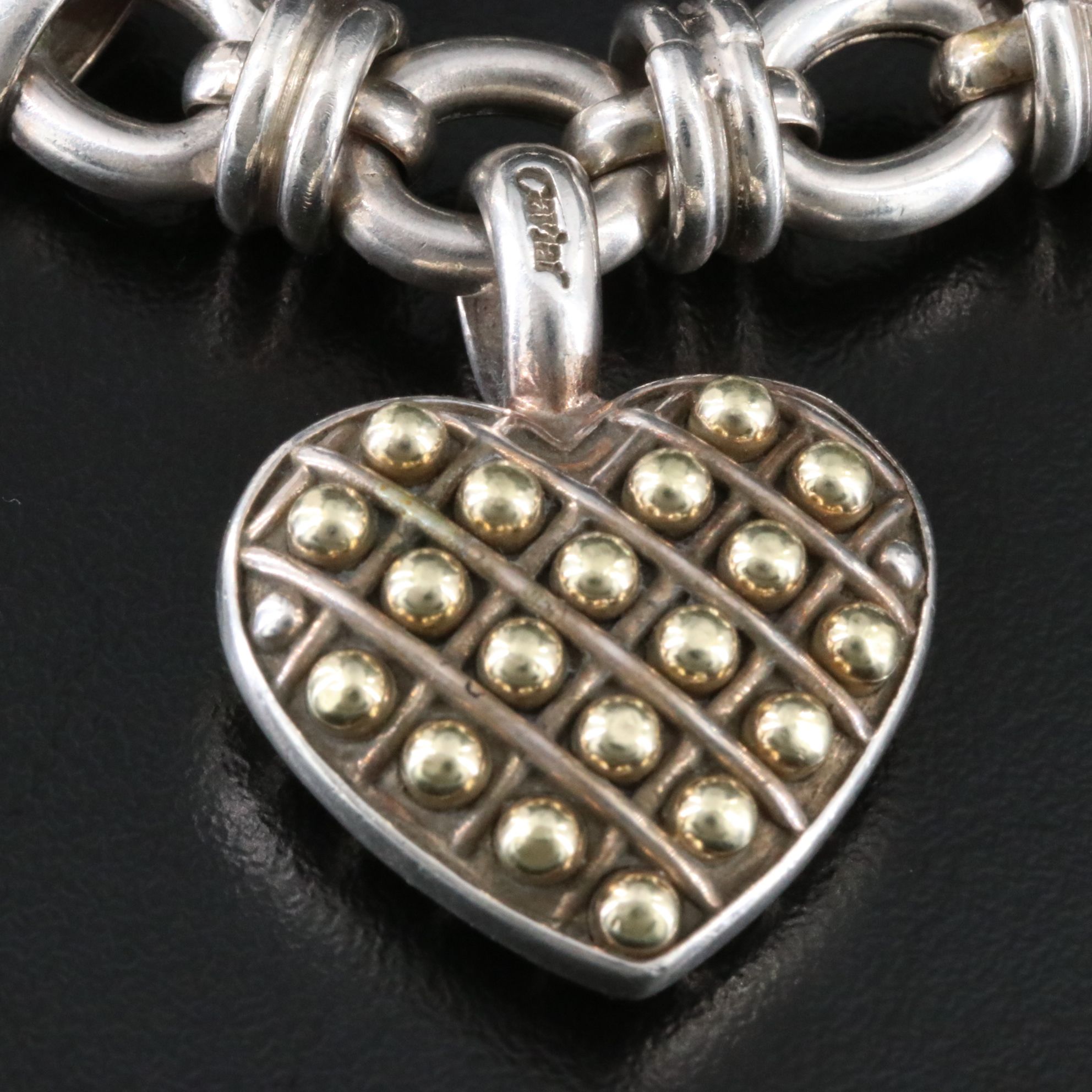 Caviar Sterling and 18K Heart Pendant on an Oval Link Charm Bracelet