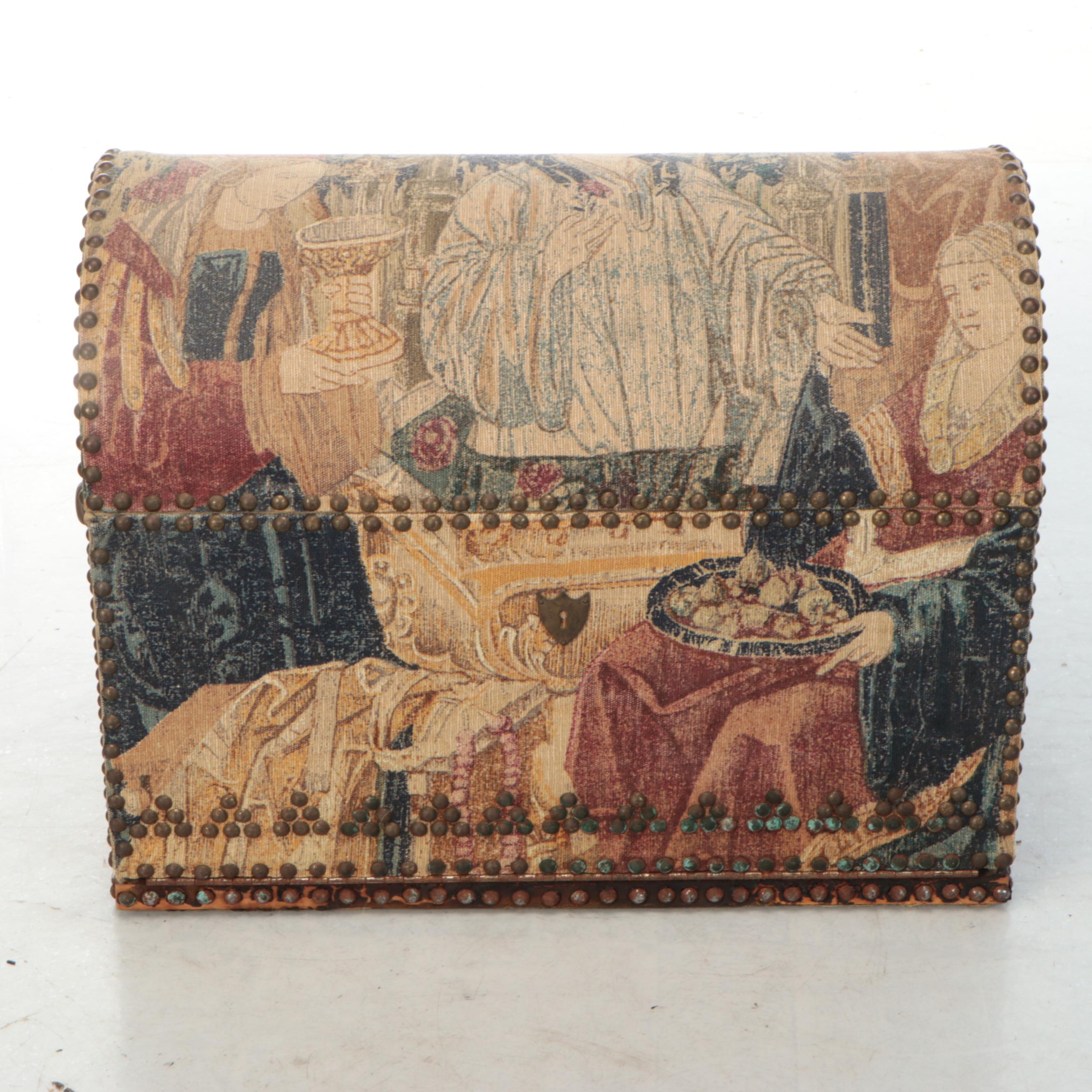 Brass-Tacked Tapestry Upholstered and Mirror Base Bombe Chest