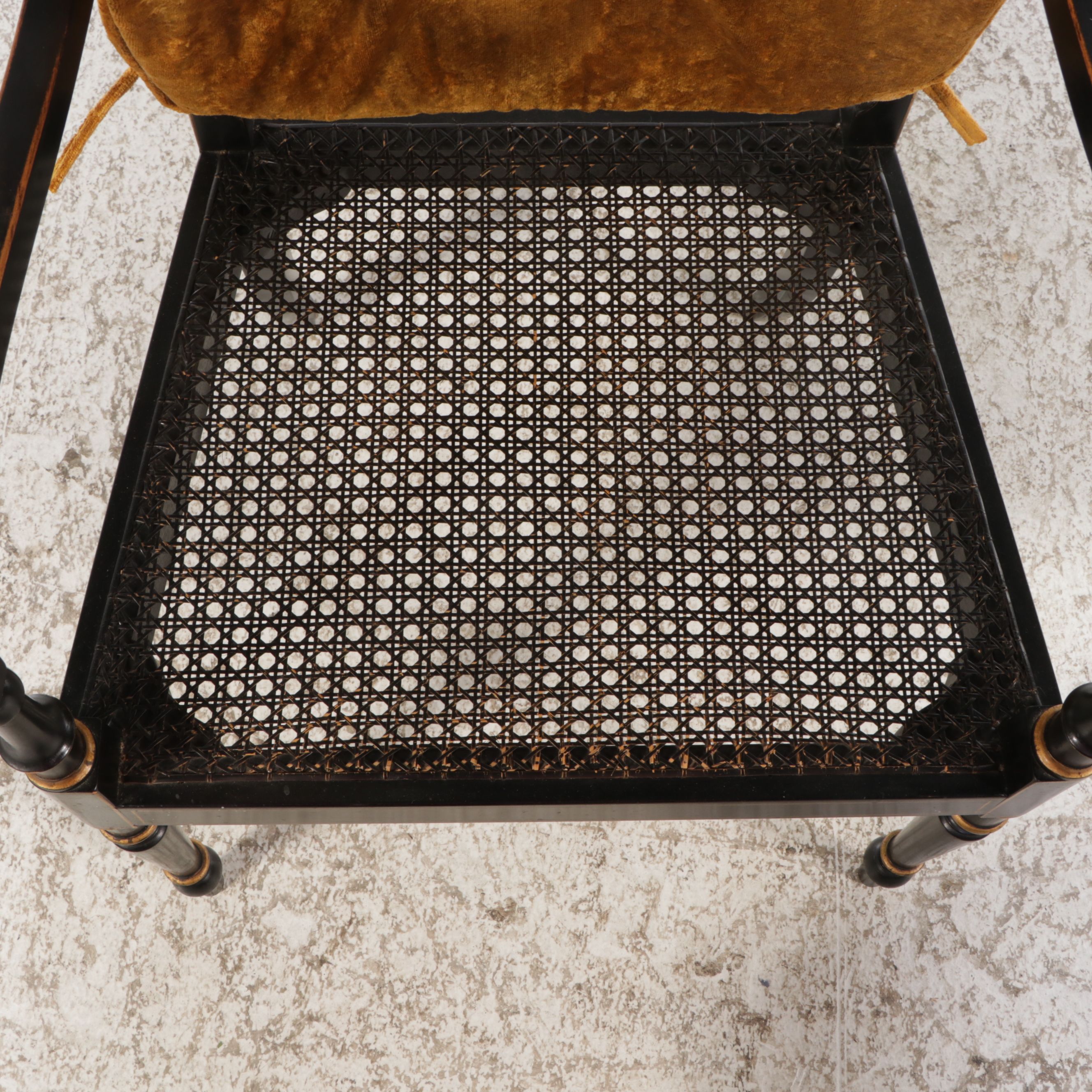 English Regency Style Gilt Accented Ebonized Wood Arm Chairs with Cane Seats