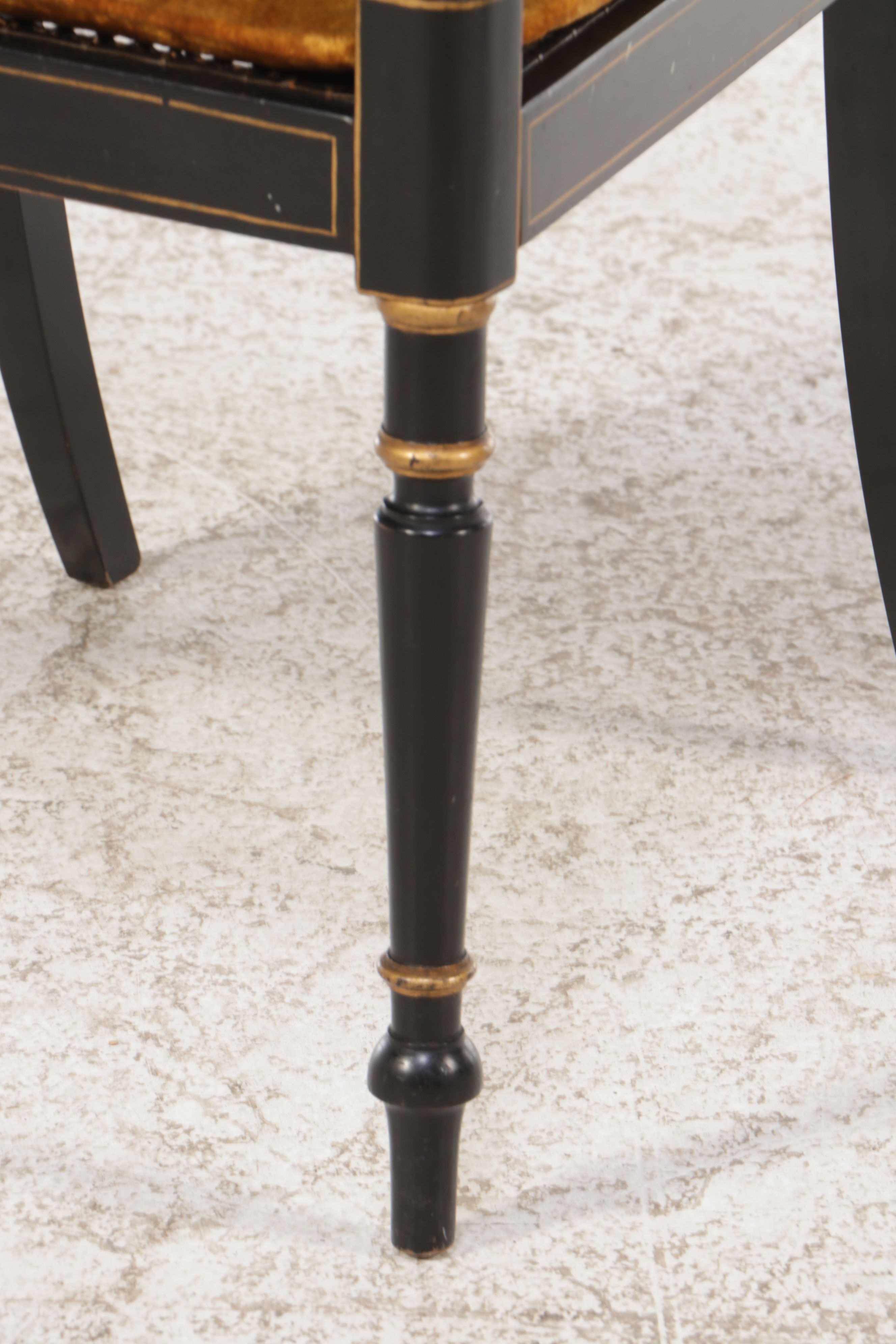 English Regency Style Gilt Accented Ebonized Wood Arm Chairs with Cane Seats