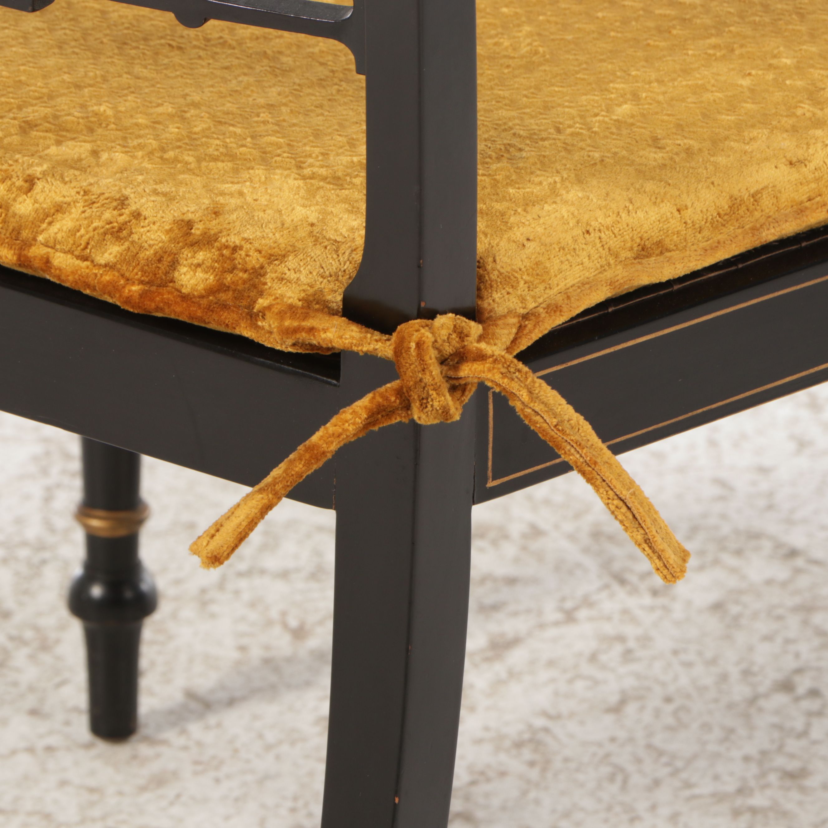 English Regency Style Gilt Accented Ebonized Wood Arm Chairs with Cane Seats