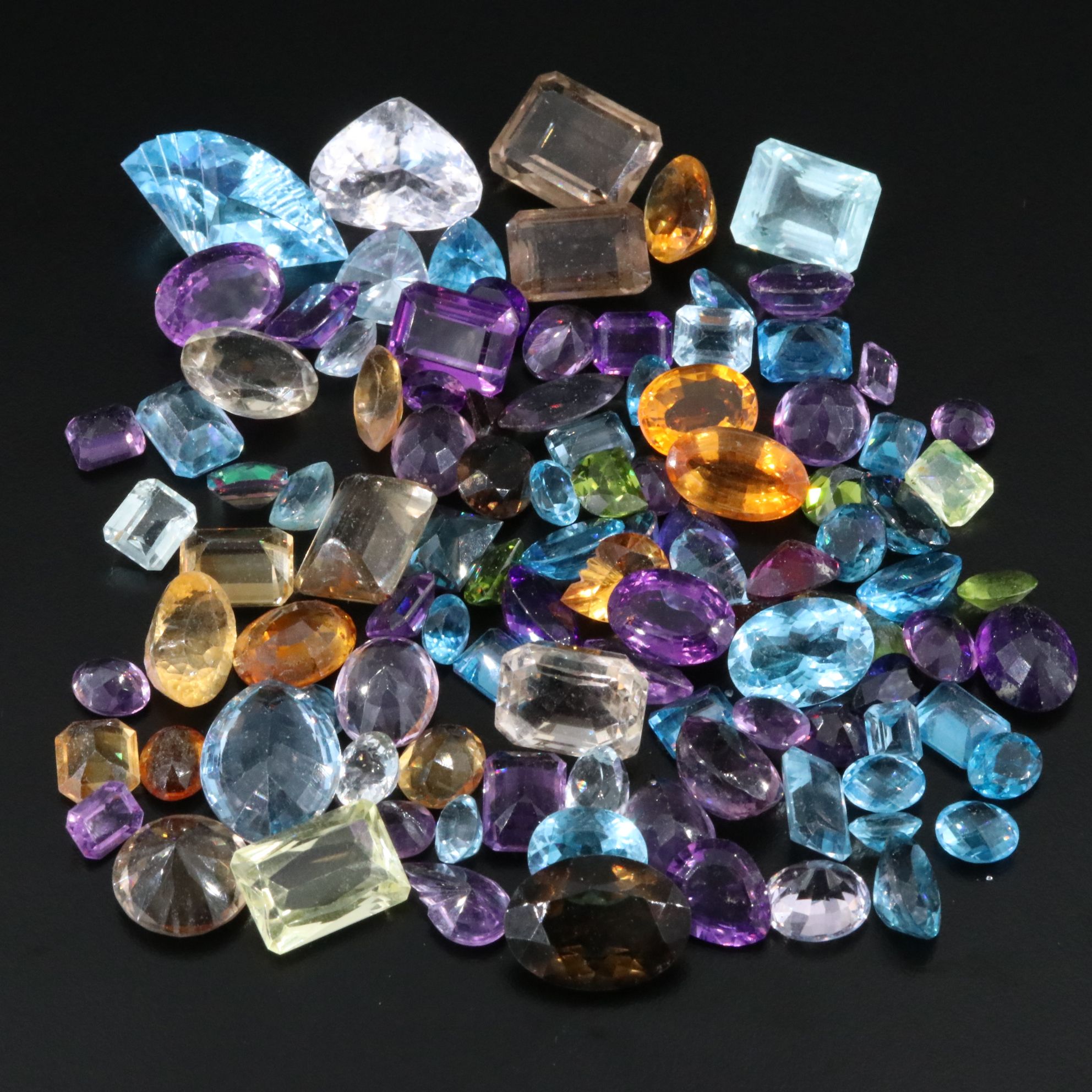 Loose 739.50 CTW Gemstone Lot Including Peridot, Topaz and Amethyst