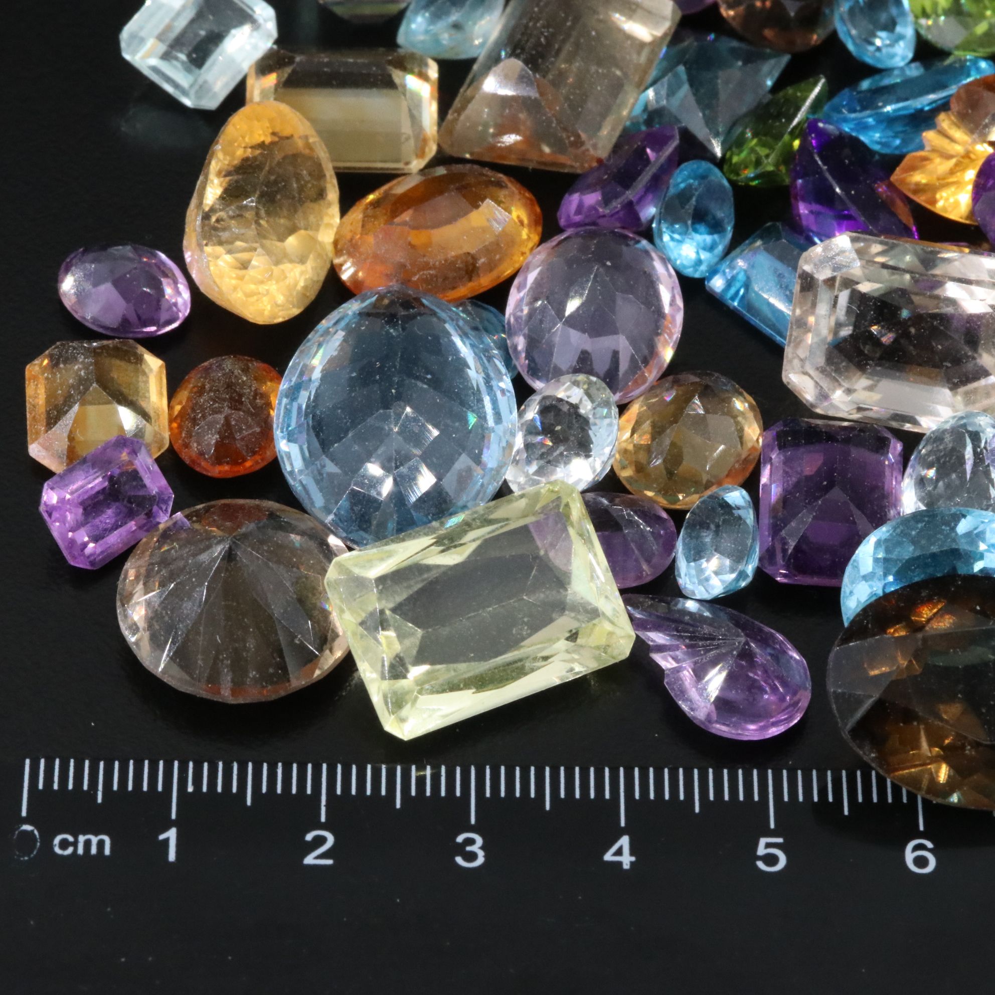 Loose 739.50 CTW Gemstone Lot Including Peridot, Topaz and Amethyst