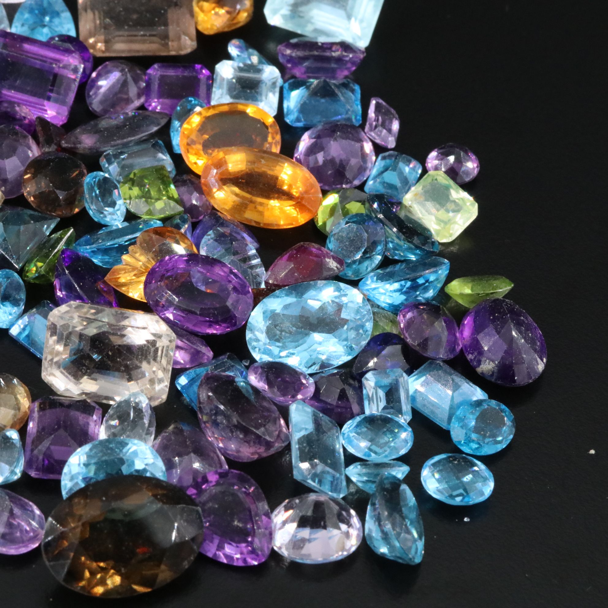 Loose 739.50 CTW Gemstone Lot Including Peridot, Topaz and Amethyst