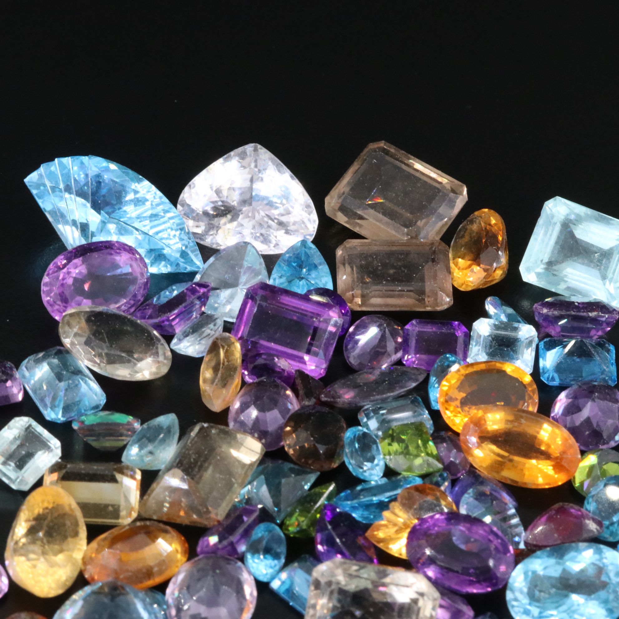 Loose 739.50 CTW Gemstone Lot Including Peridot, Topaz and Amethyst