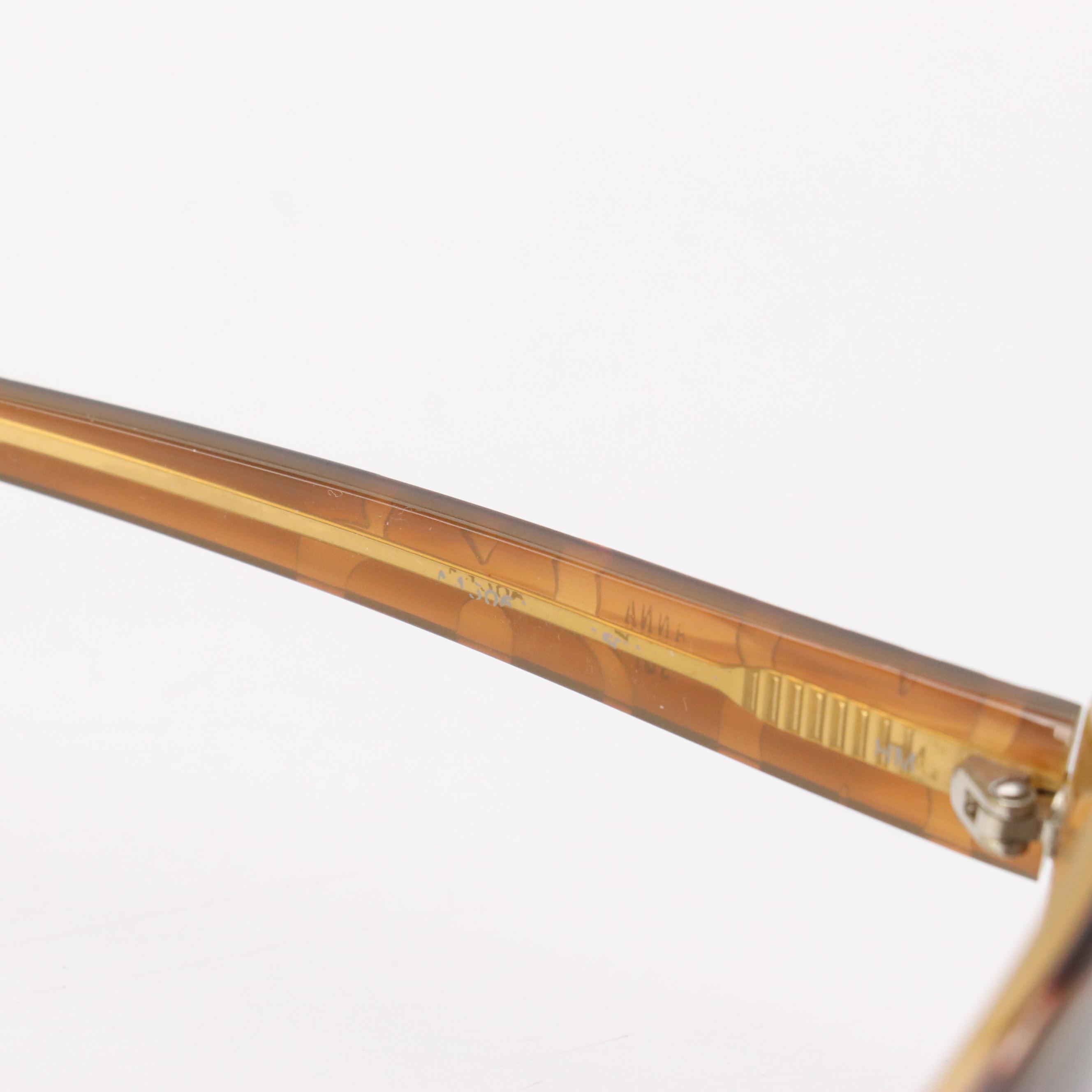 Salvatore Ferragamo Gancini Sunglasses, Anna Sui Oval Sunglasses, and More