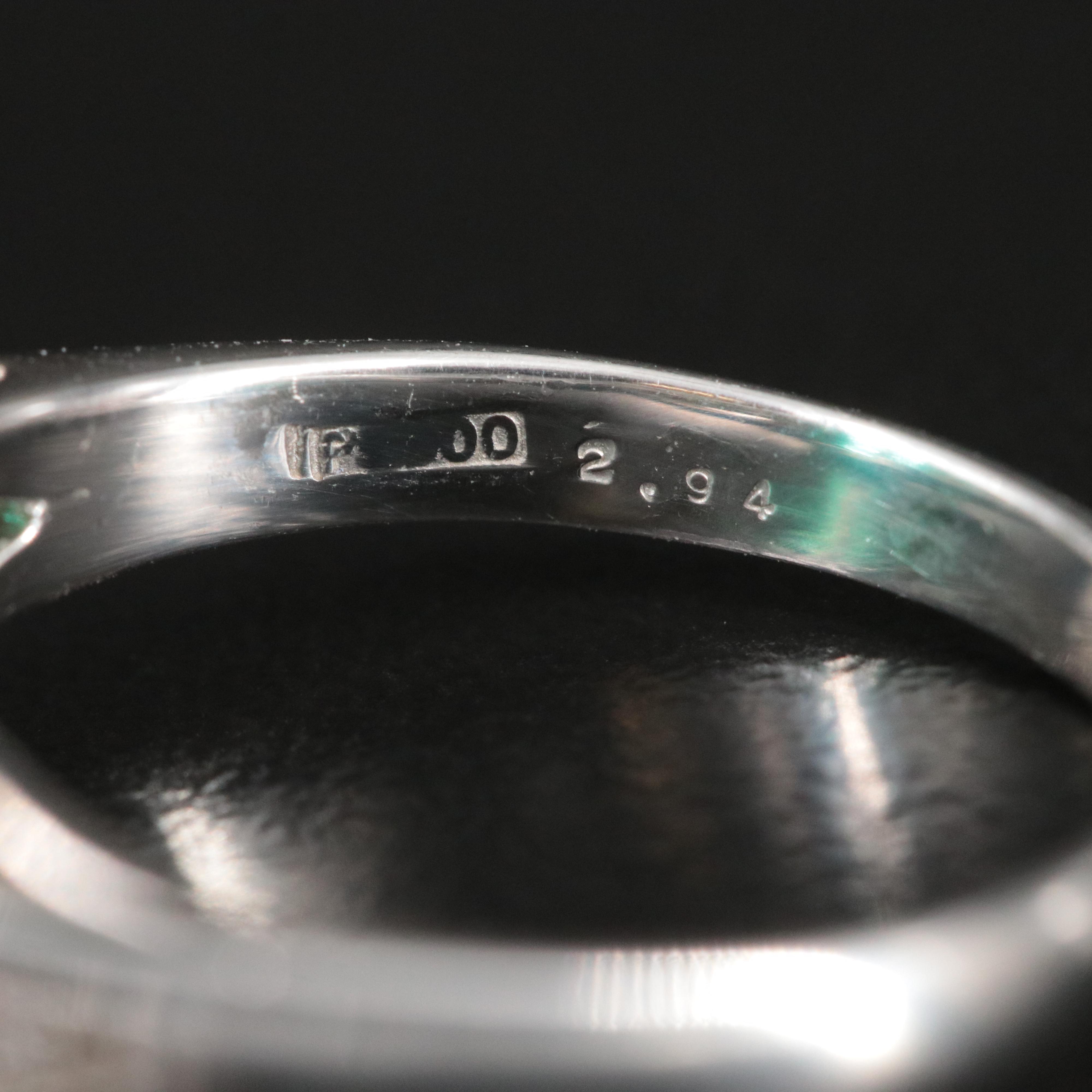 Platinum Emerald and 0.48 CTW Diamond Ring