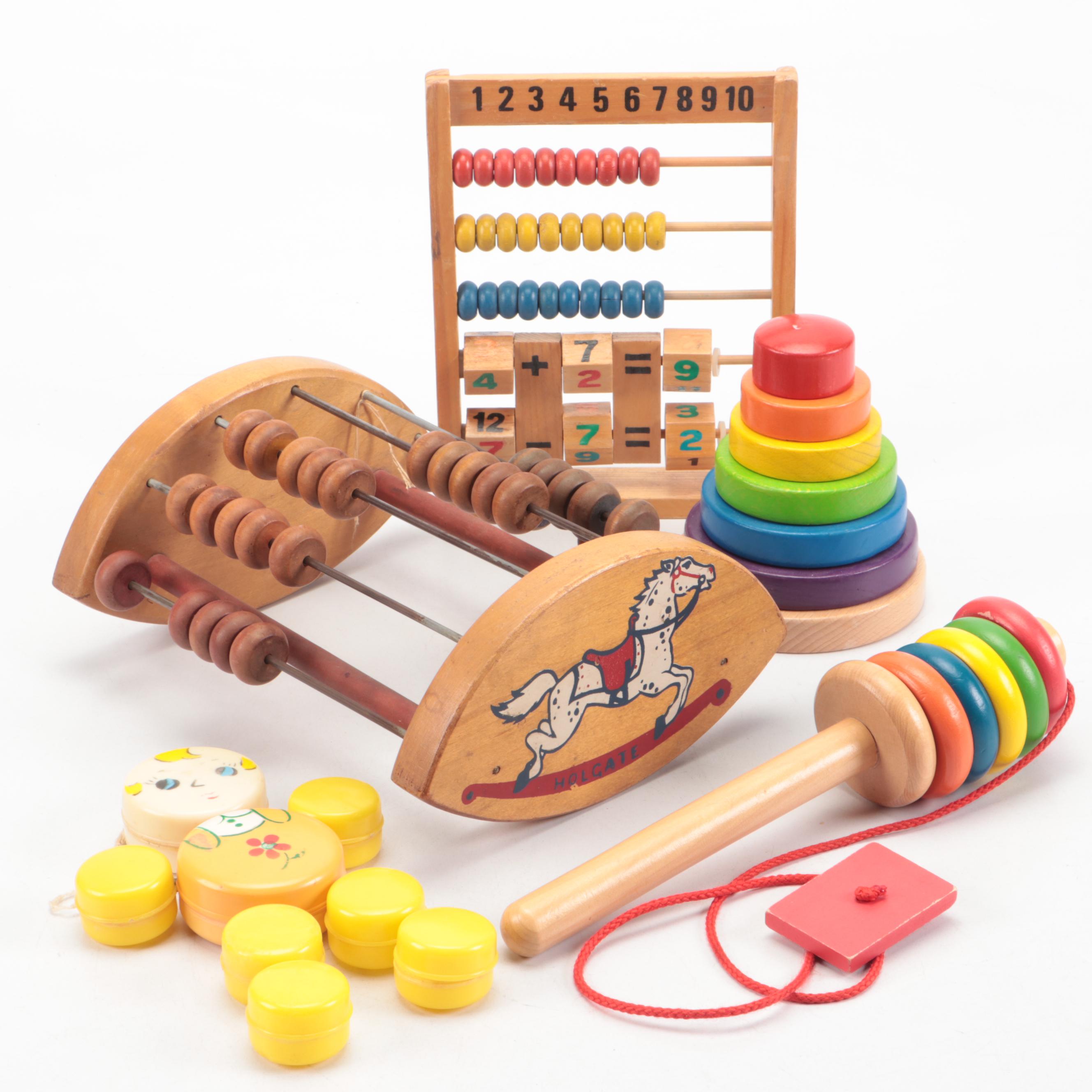 Painted Wood Toy Collection Featuring Abacuses and Stacking Toys