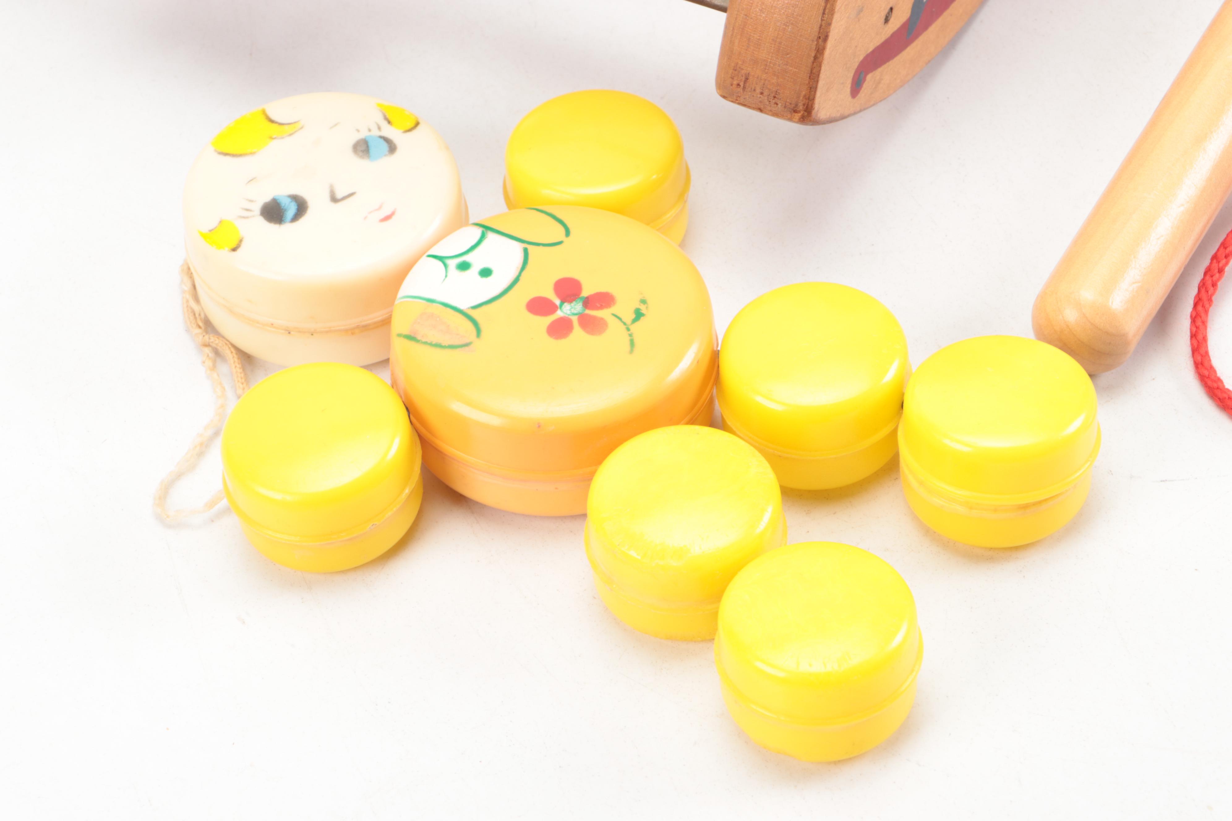 Painted Wood Toy Collection Featuring Abacuses and Stacking Toys