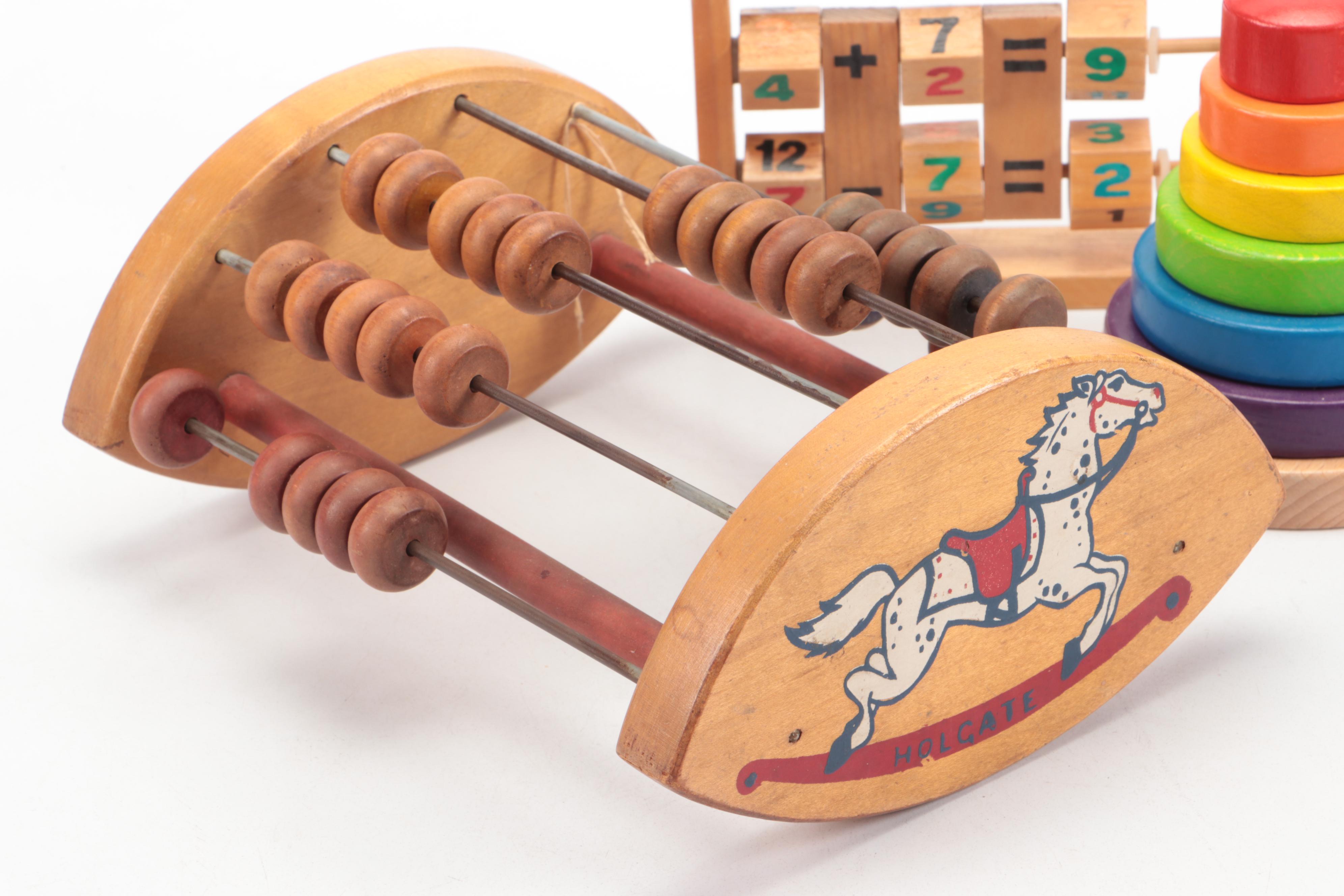 Painted Wood Toy Collection Featuring Abacuses and Stacking Toys