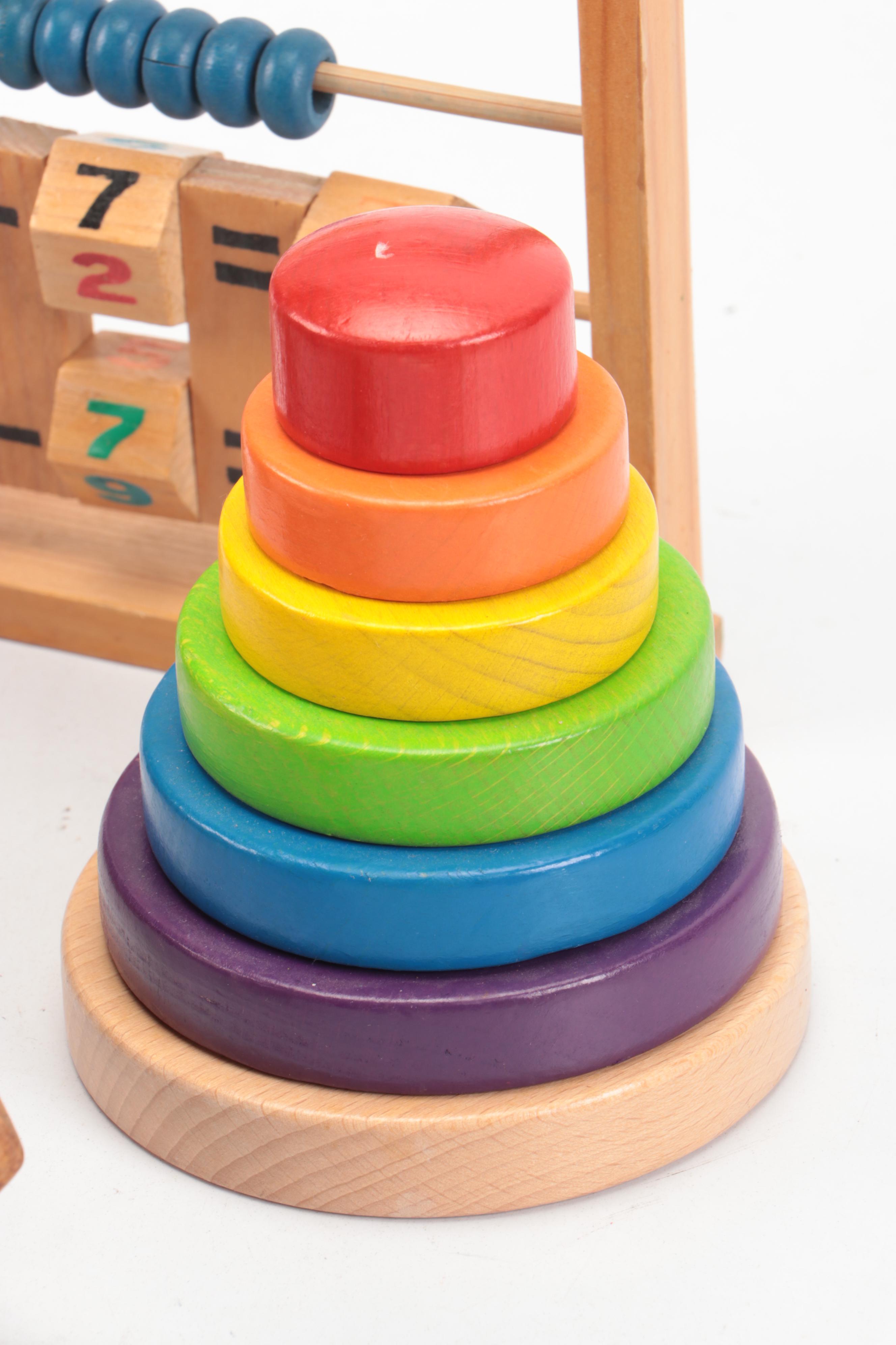 Painted Wood Toy Collection Featuring Abacuses and Stacking Toys