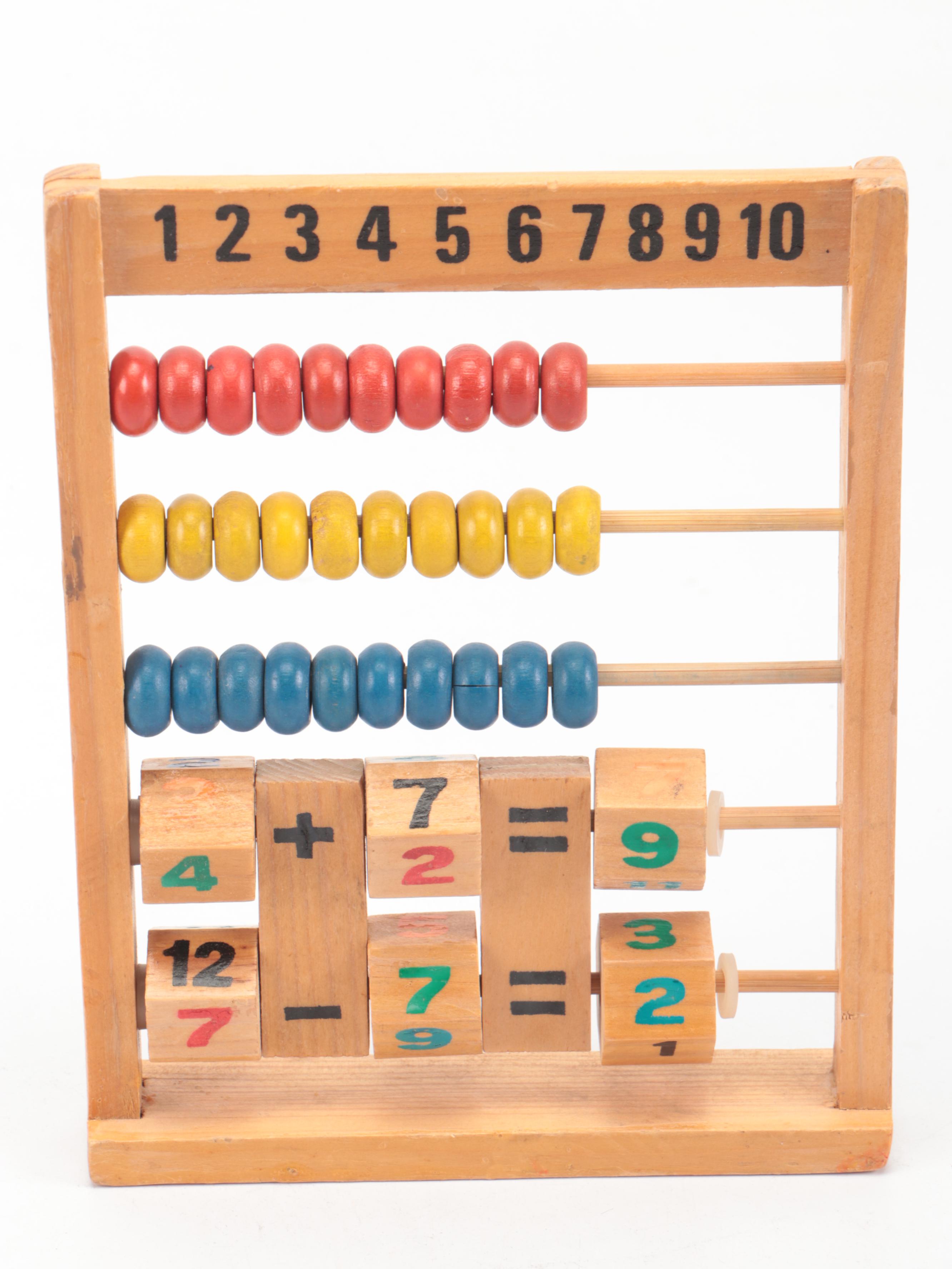Painted Wood Toy Collection Featuring Abacuses and Stacking Toys