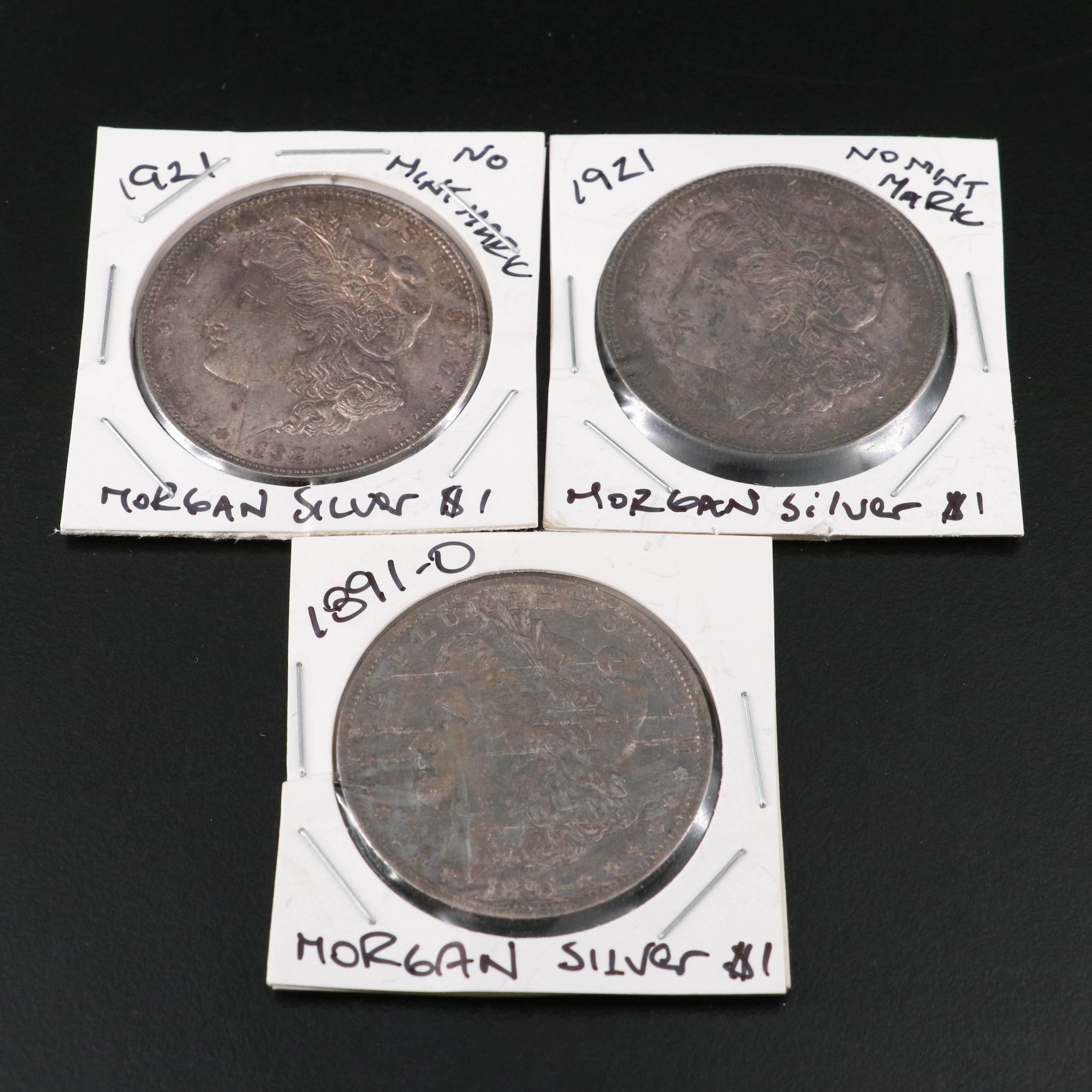 Nine Morgan Silver Dollars
