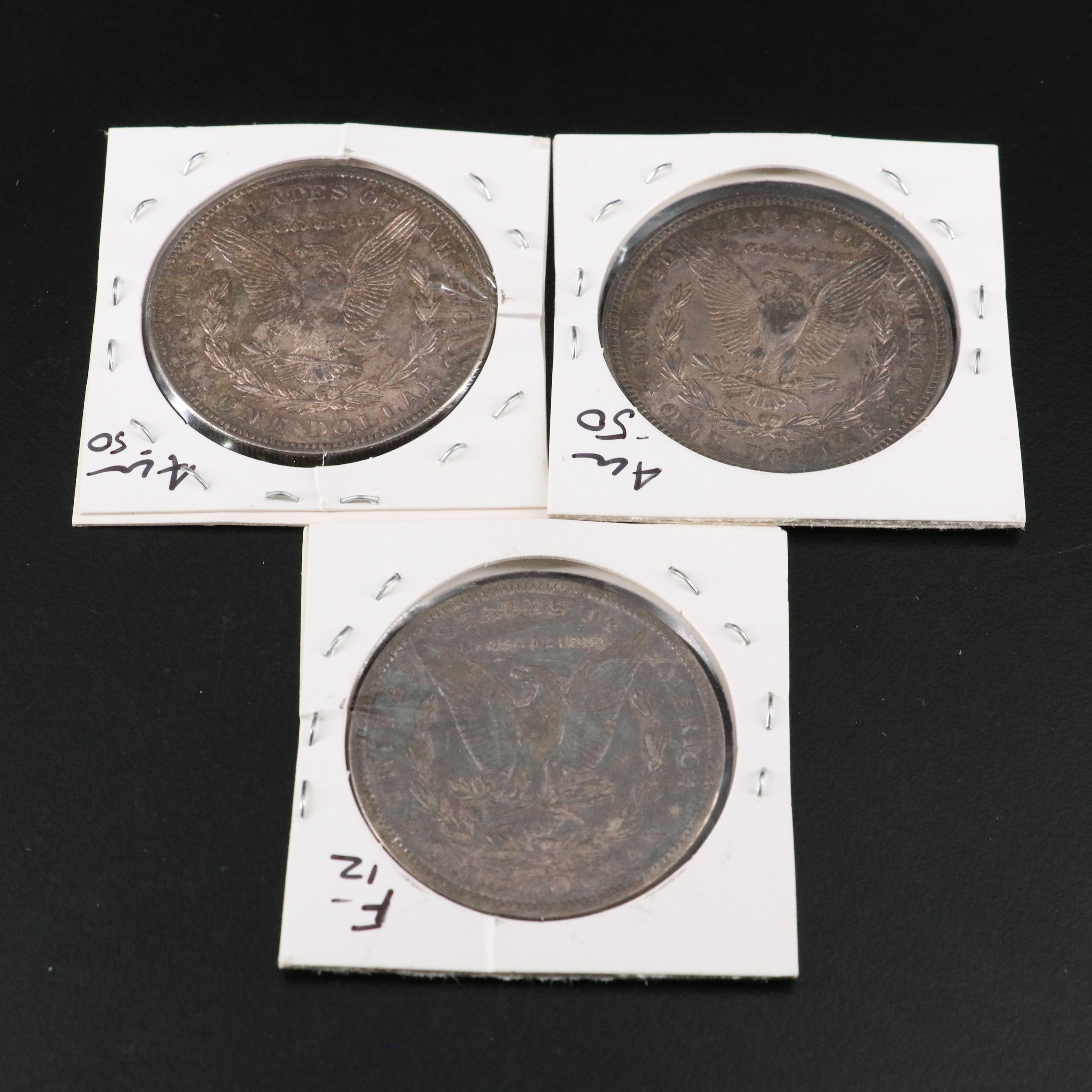 Nine Morgan Silver Dollars