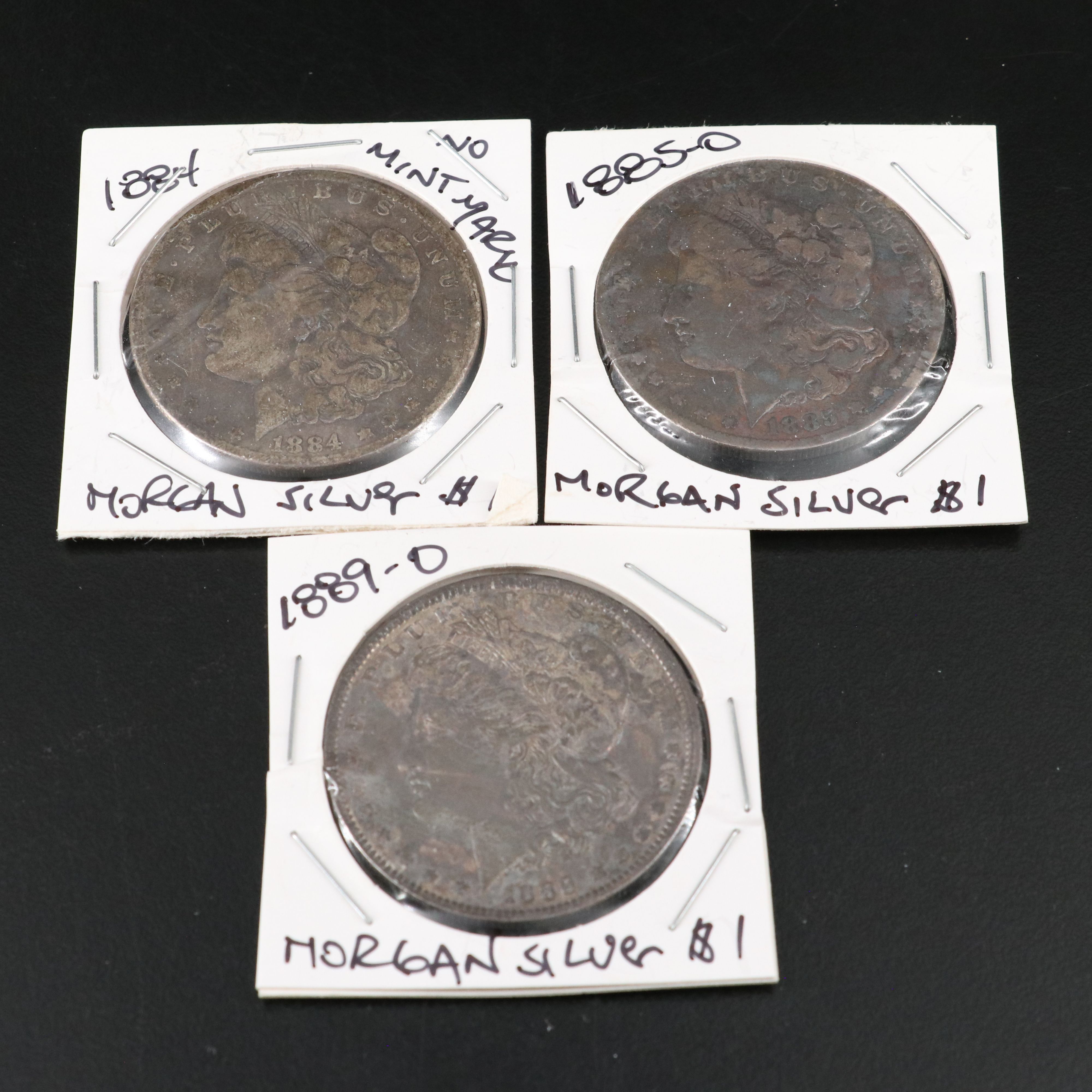 Nine Morgan Silver Dollars