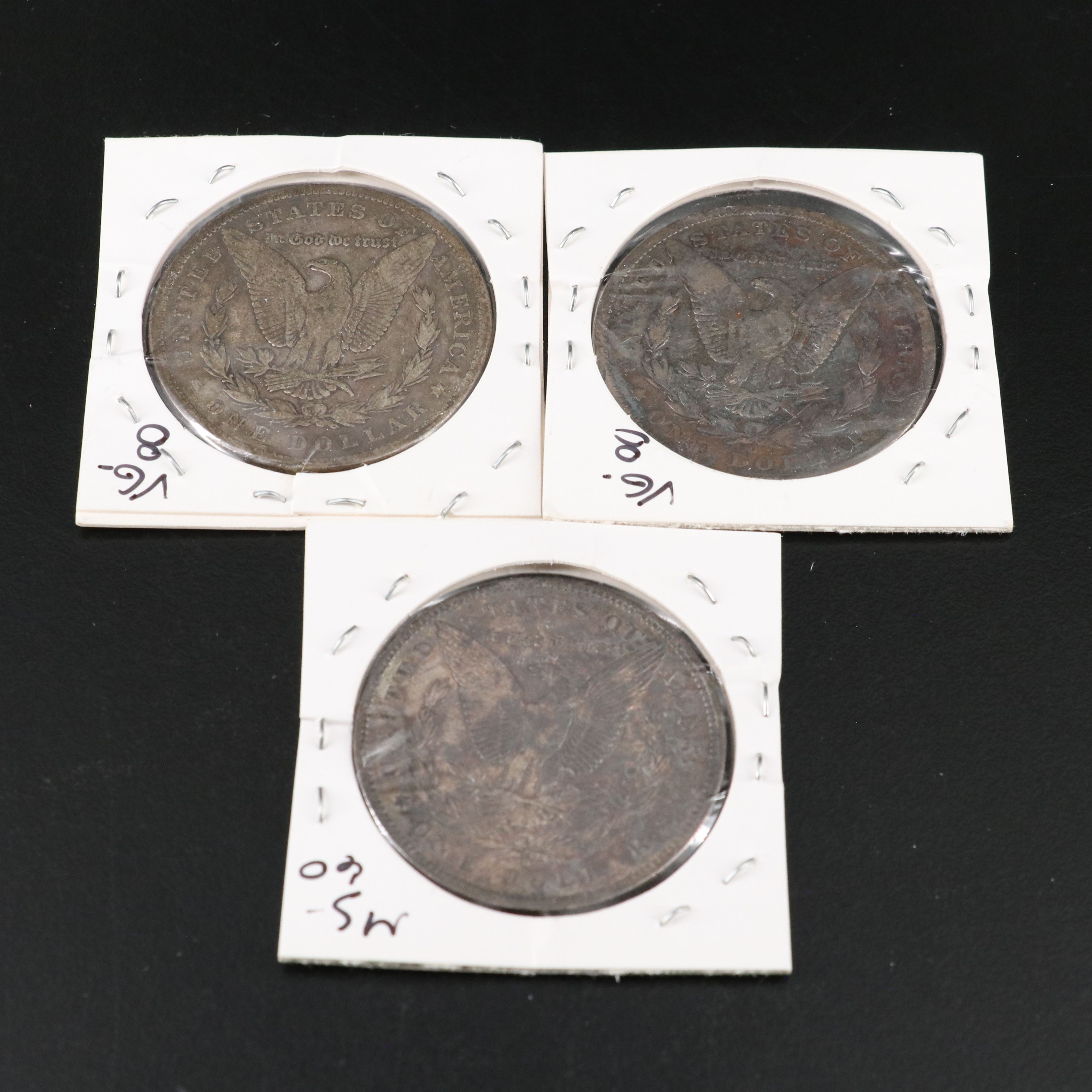 Nine Morgan Silver Dollars