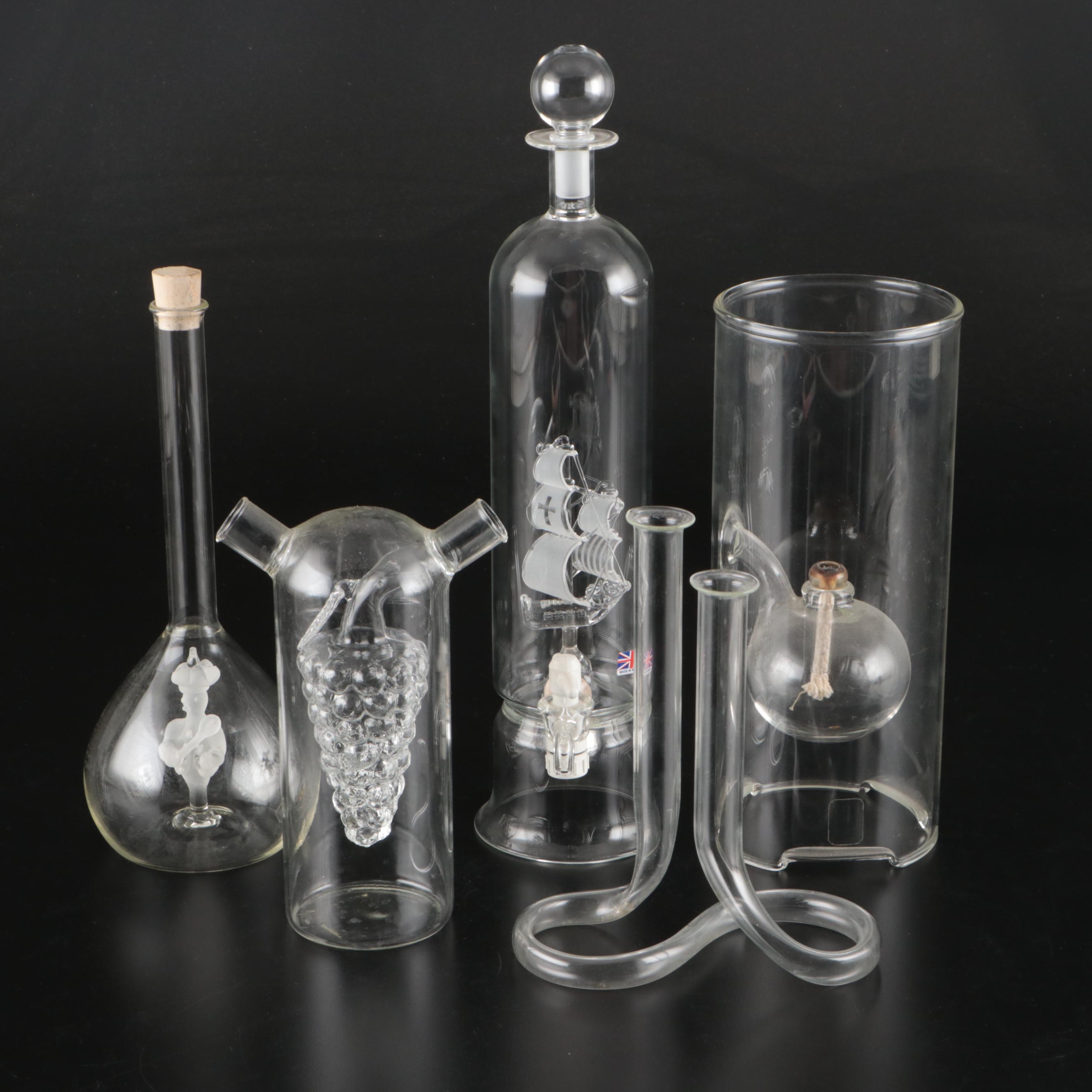 Blown Glass Ship in a Bottle Drinks Dispenser with Other Bottles and Decor