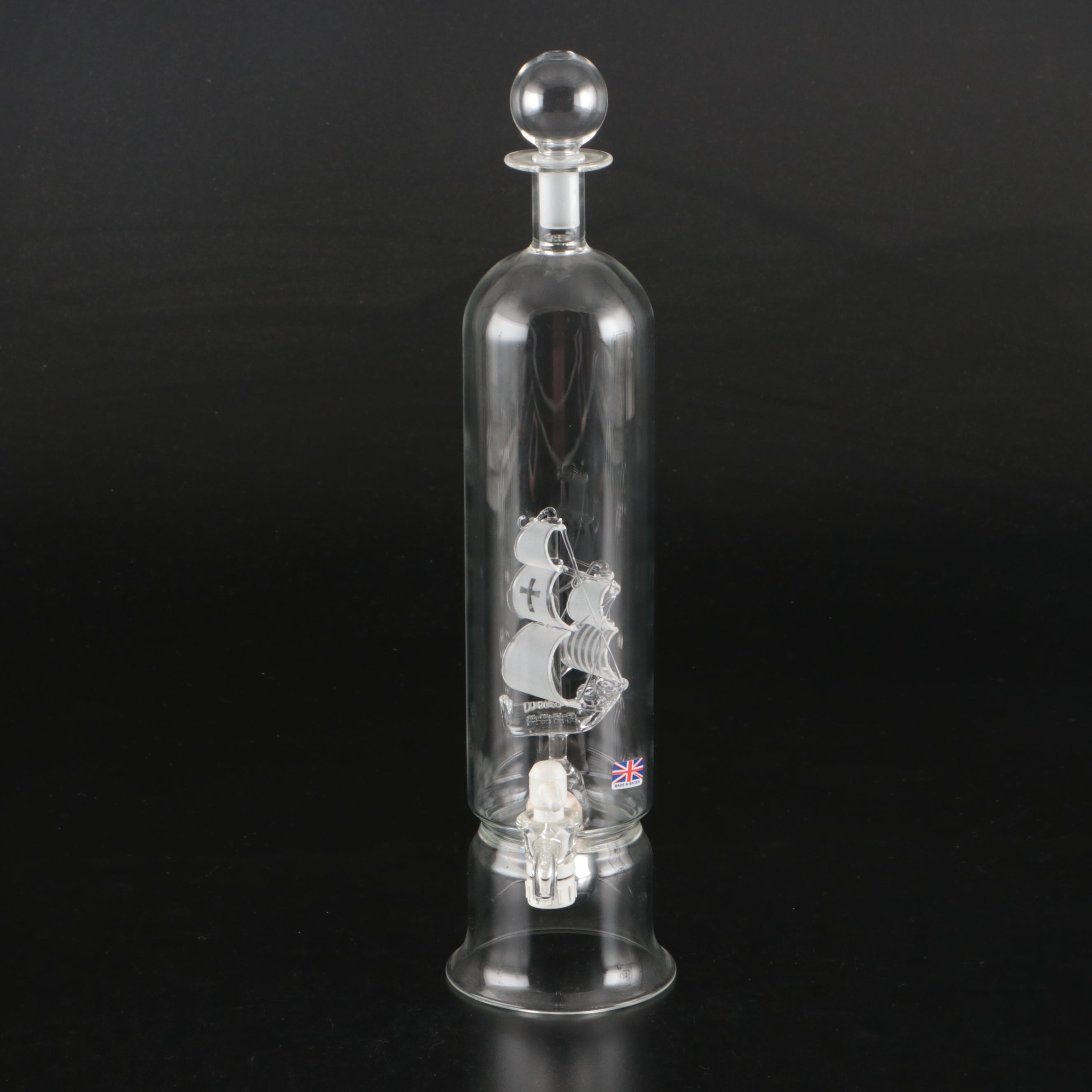 Blown Glass Ship in a Bottle Drinks Dispenser with Other Bottles and Decor