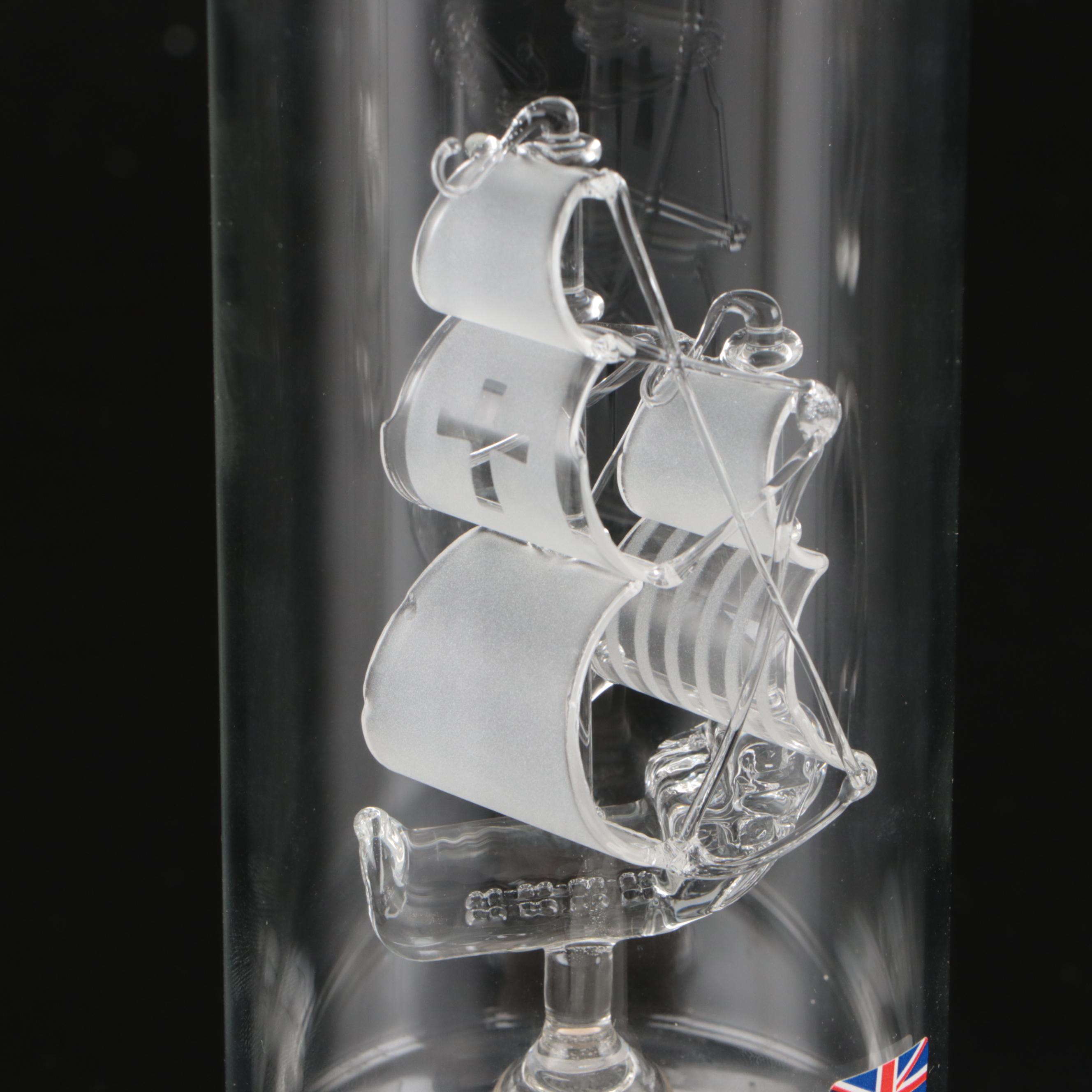 Blown Glass Ship in a Bottle Drinks Dispenser with Other Bottles and Decor