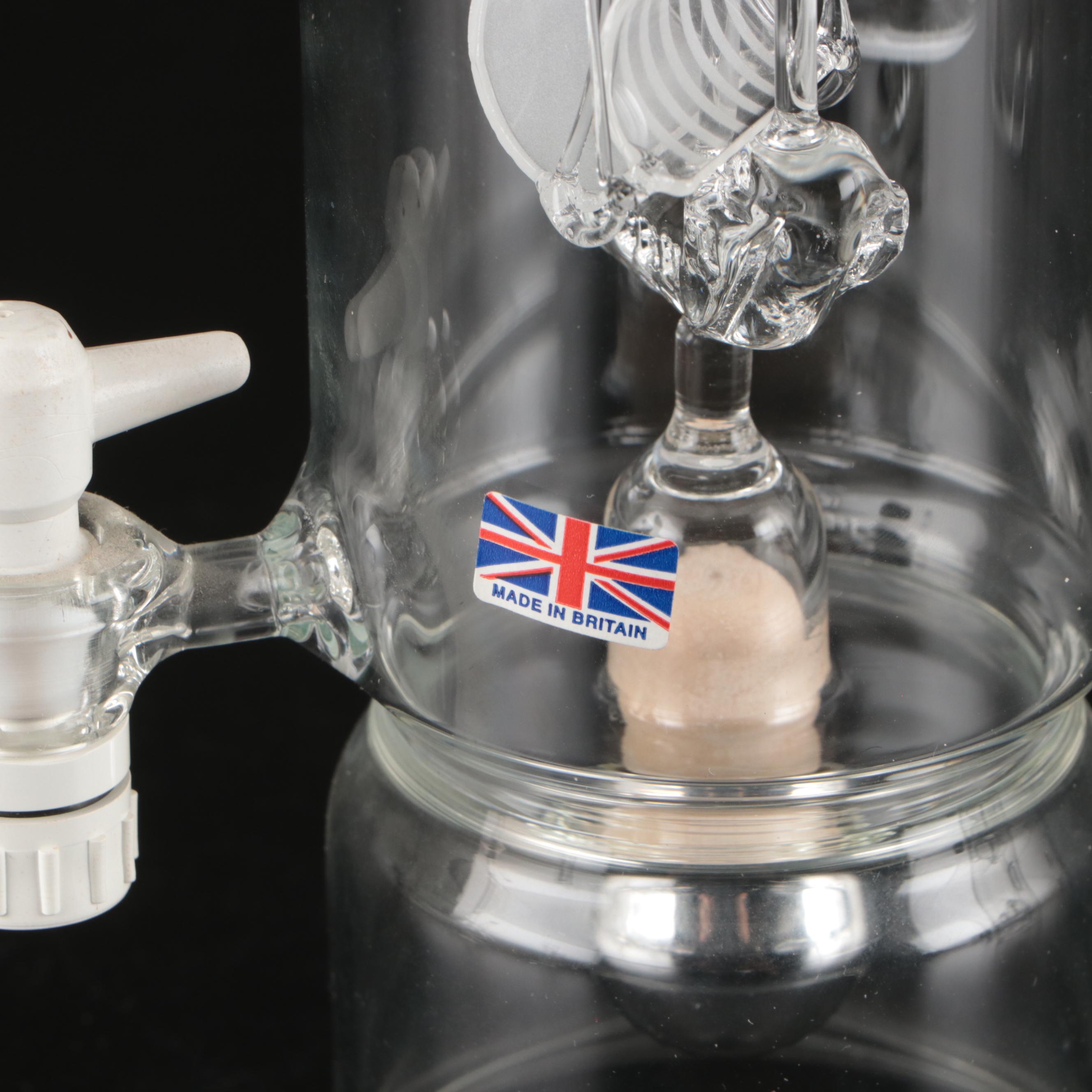 Blown Glass Ship in a Bottle Drinks Dispenser with Other Bottles and Decor