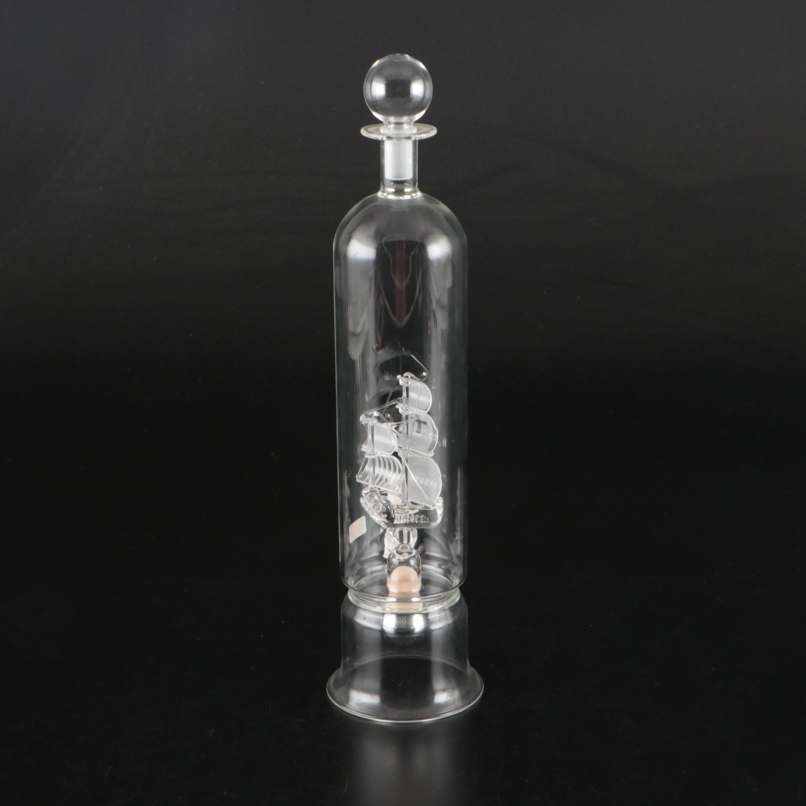 Blown Glass Ship in a Bottle Drinks Dispenser with Other Bottles and Decor