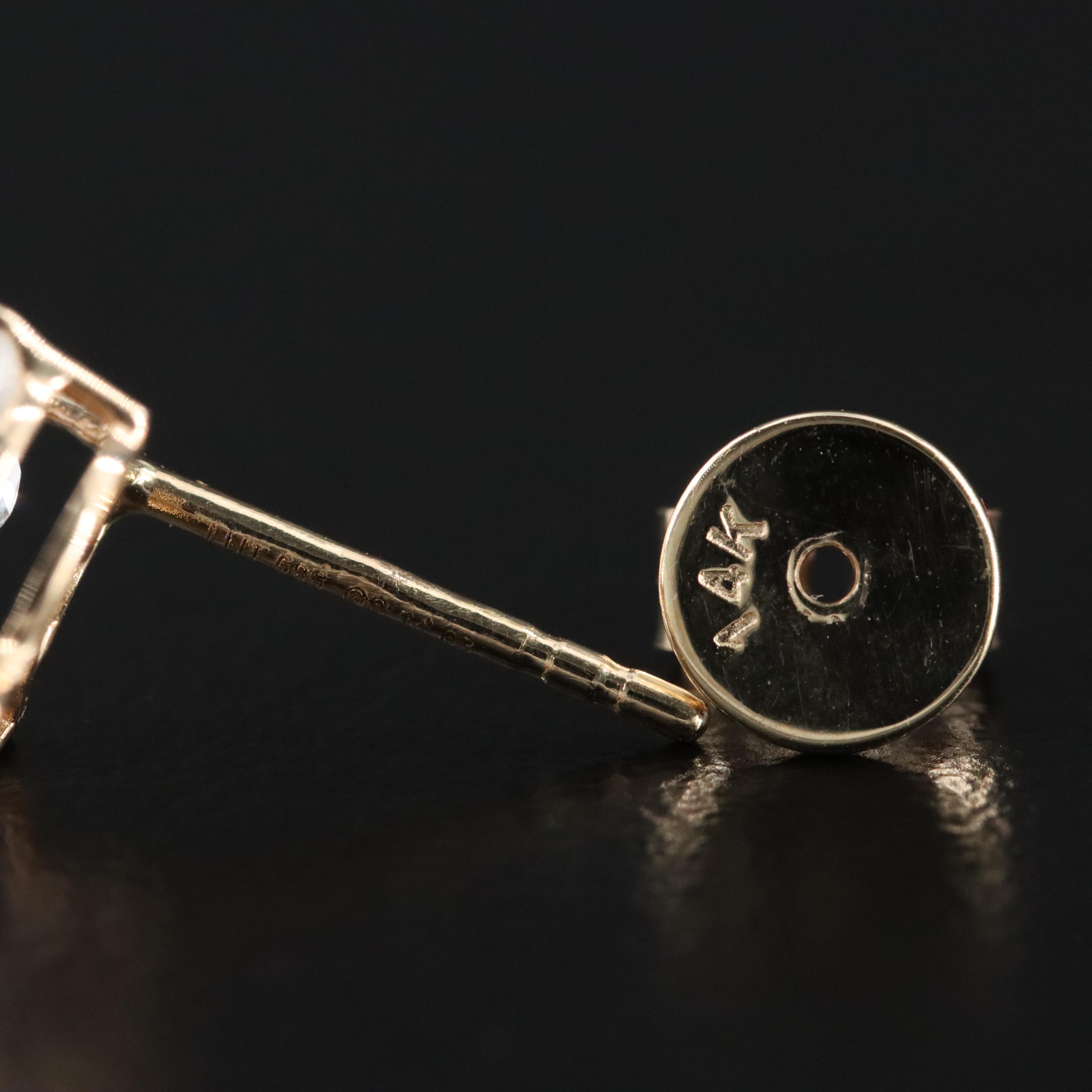 14K 7.07 CTW Ruby and White Sapphire Earrings with IGI Jewelry Report