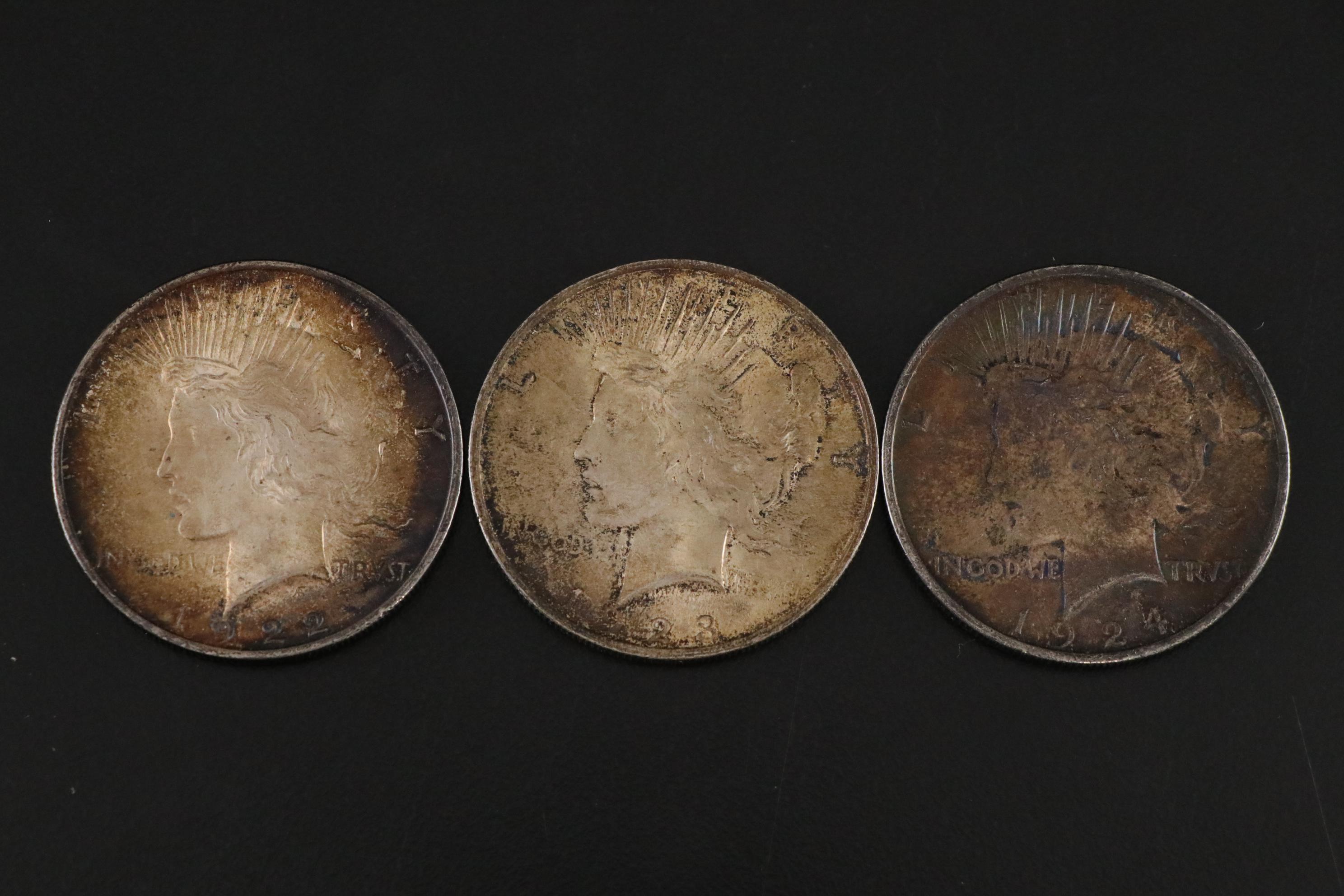 Three Peace Dollars, One 1964 Kennedy Half Dollar, and Other US Coins