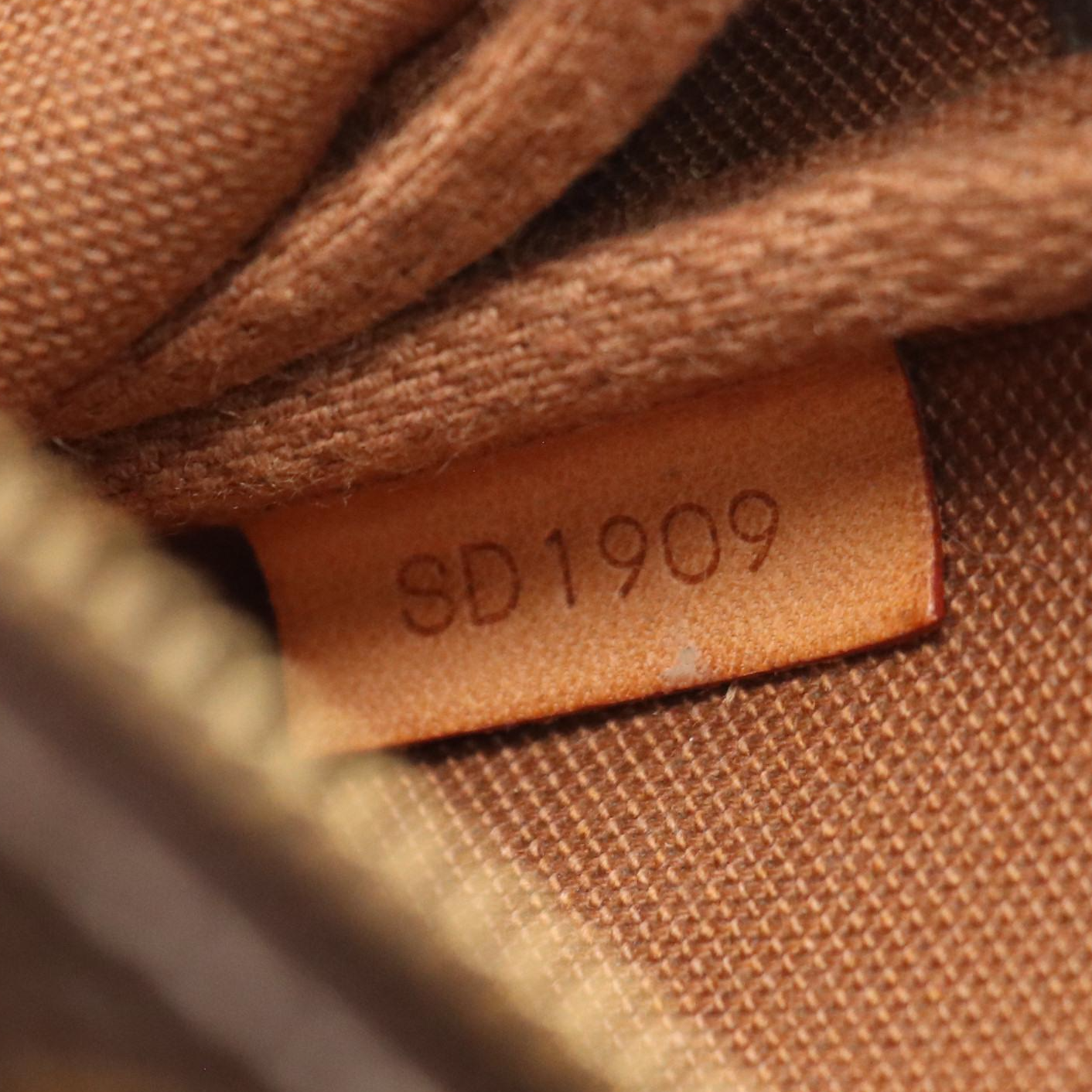 Louis Vuitton Zip Pochette in Monogram Canvas and Leather