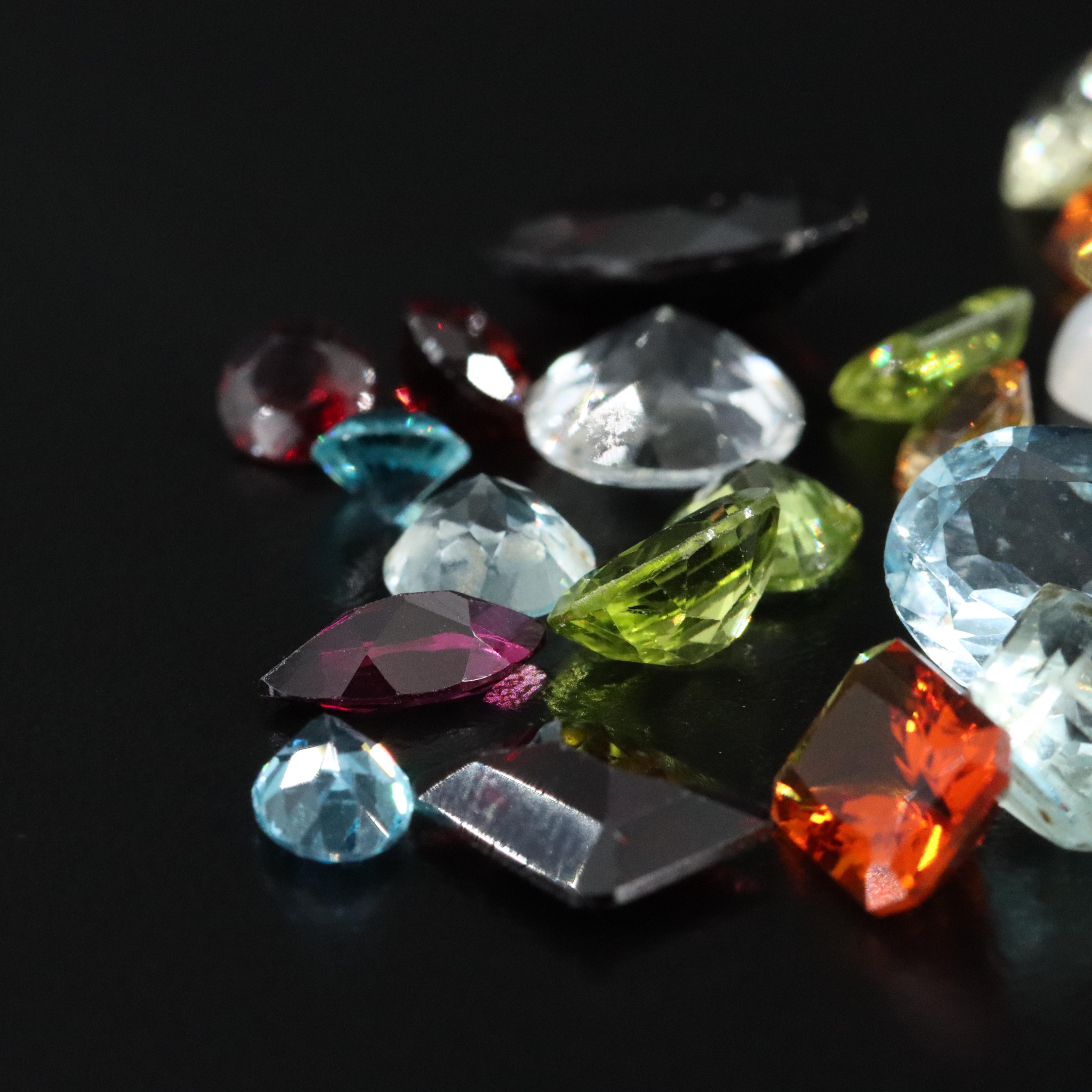 Loose 68.37 CTW Gemstone Lot Including Rainbow Moonstone, Peridot and Topaz