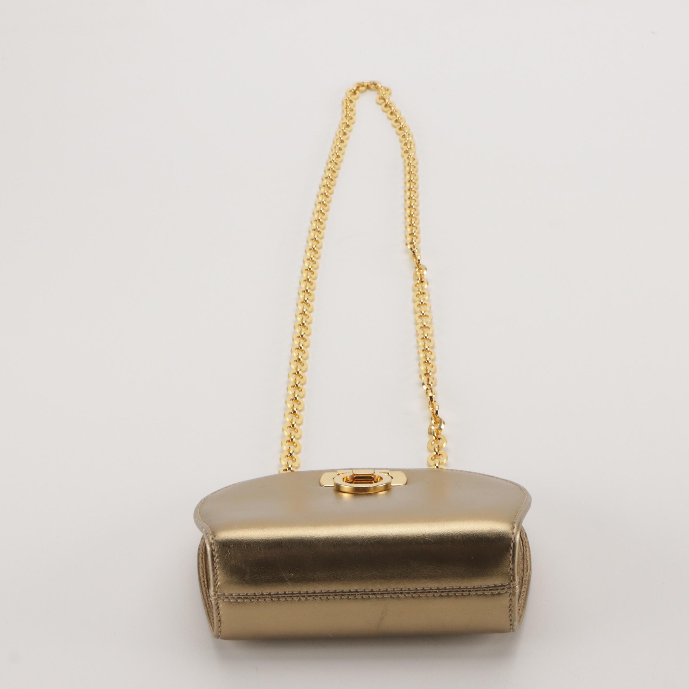 Salvatore Ferragamo Gancini-Lock Clutch on Chain in Metallic Gold Leather