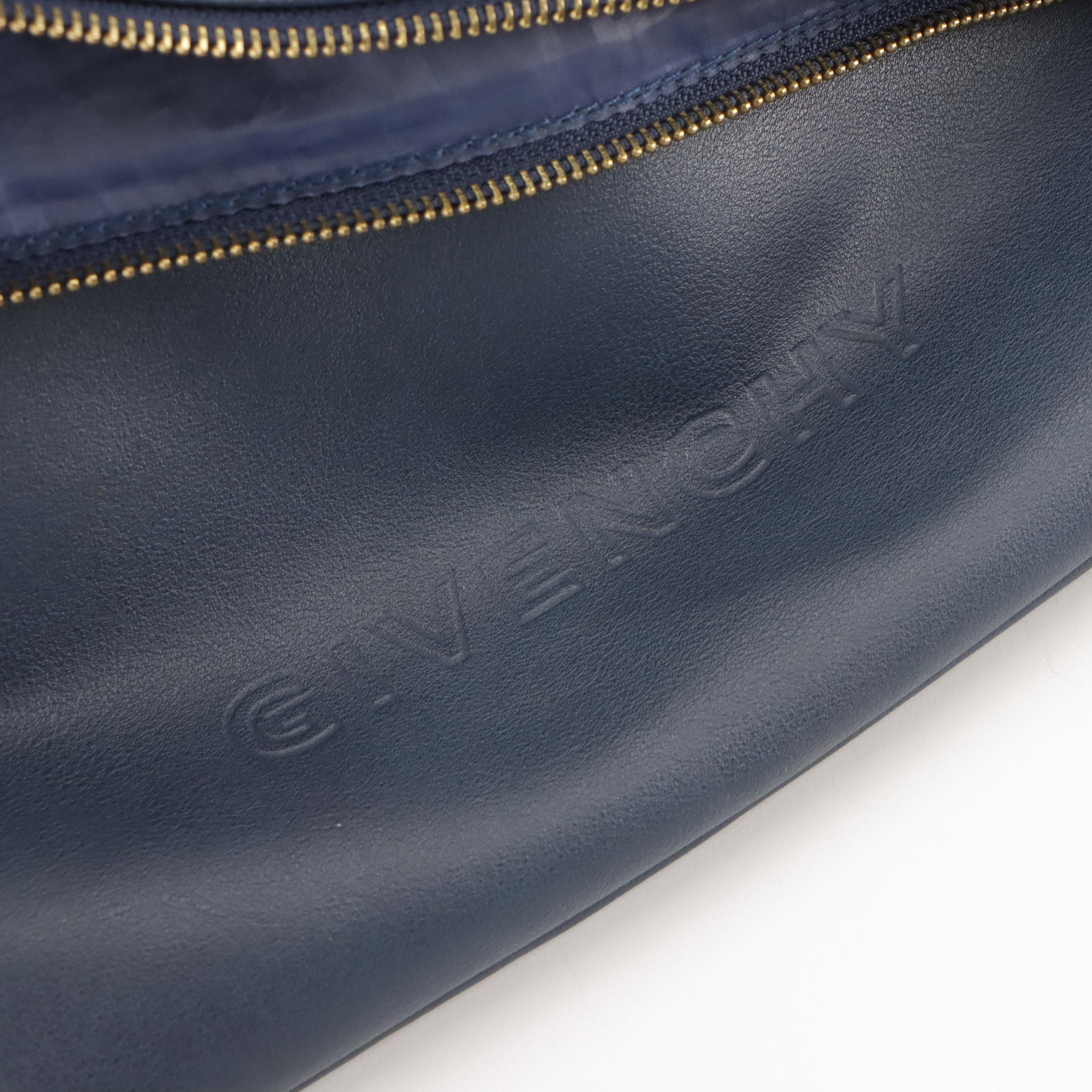 Givenchy Logo Embossed Fold Over Convertible Tassel Bag in Navy Vegan Leather